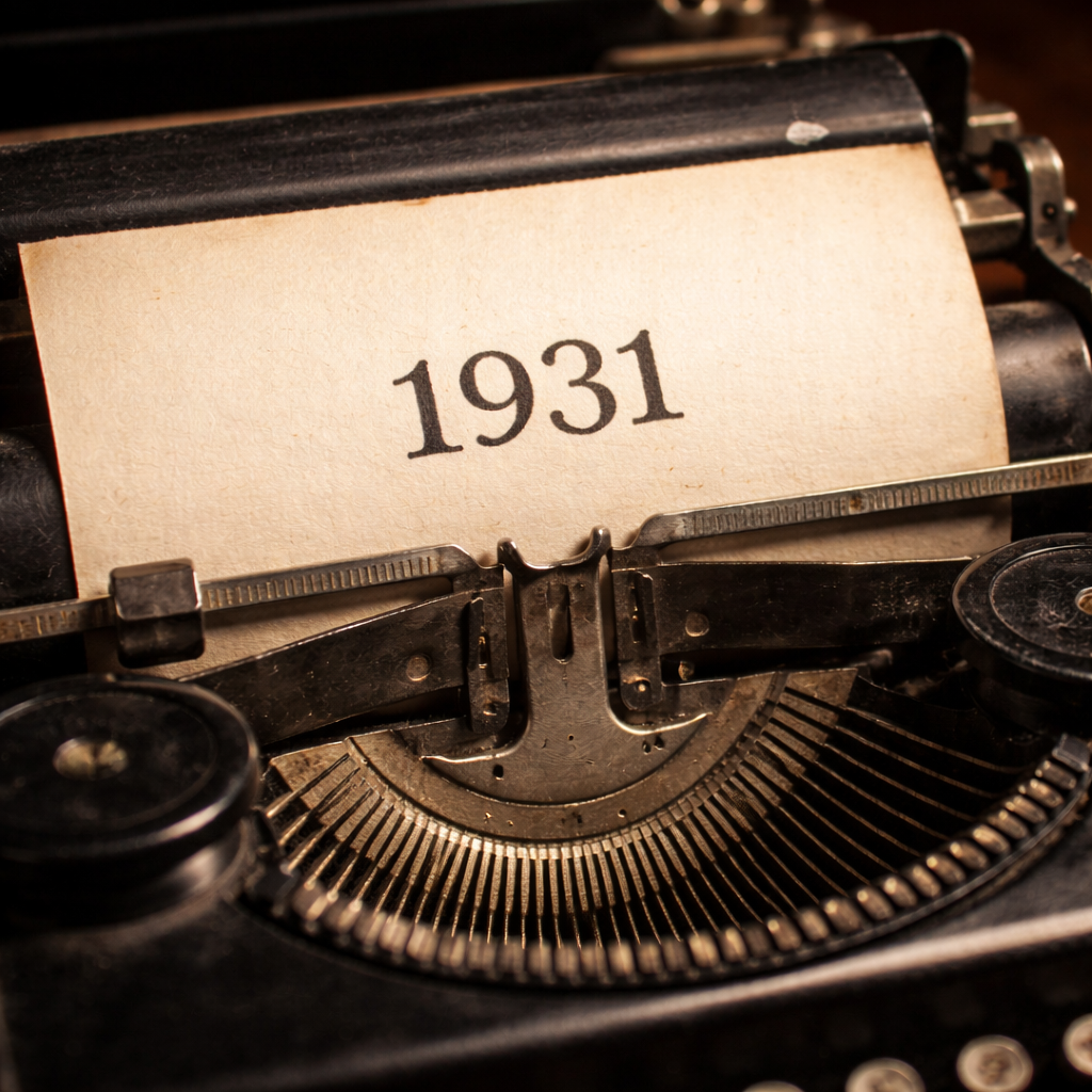 Close-up of a vintage typewriter with a paper displaying the year 1931. This represents the 1931 Adventist statement of fundamental beliefs.