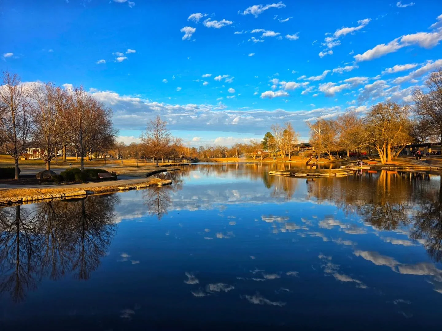 There may still be a chill in the air, brown, dreary scenery and short days, but soon it will all transform to the vibrant colors and warmth of spring!

#landscape #landscapephotography #bluesky #reflection #park