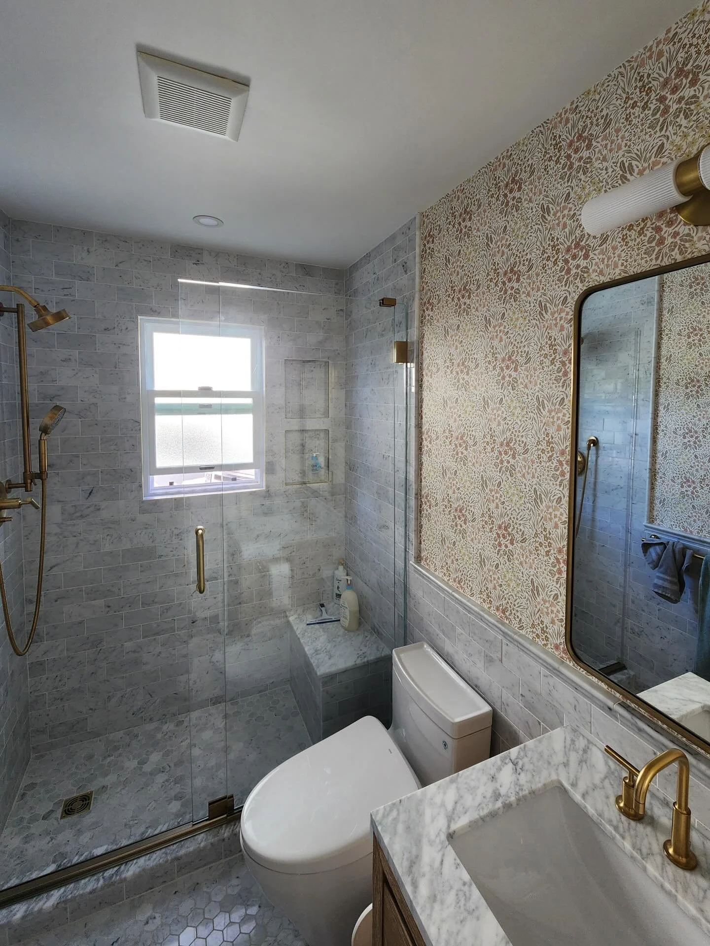 Take a look at this classic bathroom remodel in Aptos, featuring heated floors, frameless glass shower, timeless carerra marble tile, and beautiful modern brass fixtures. Thanks again to our awesome clients!