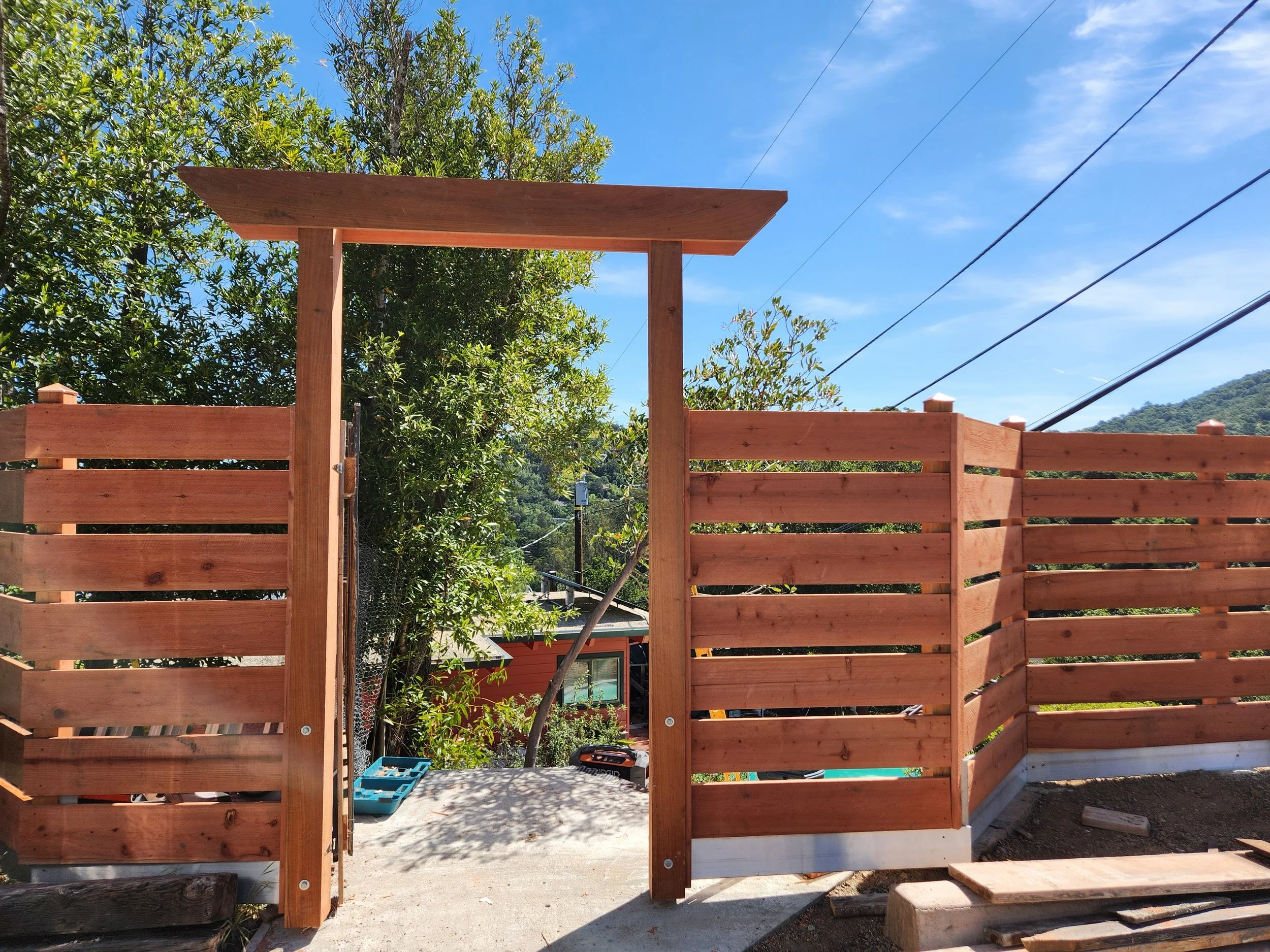 Locally milled redwood, built into a warm privacy fence with a simple walkway arch. Natural, clean, and made to age beautifully.

#redwoodfence #locallymilled #customfence #santacruz #carpentry