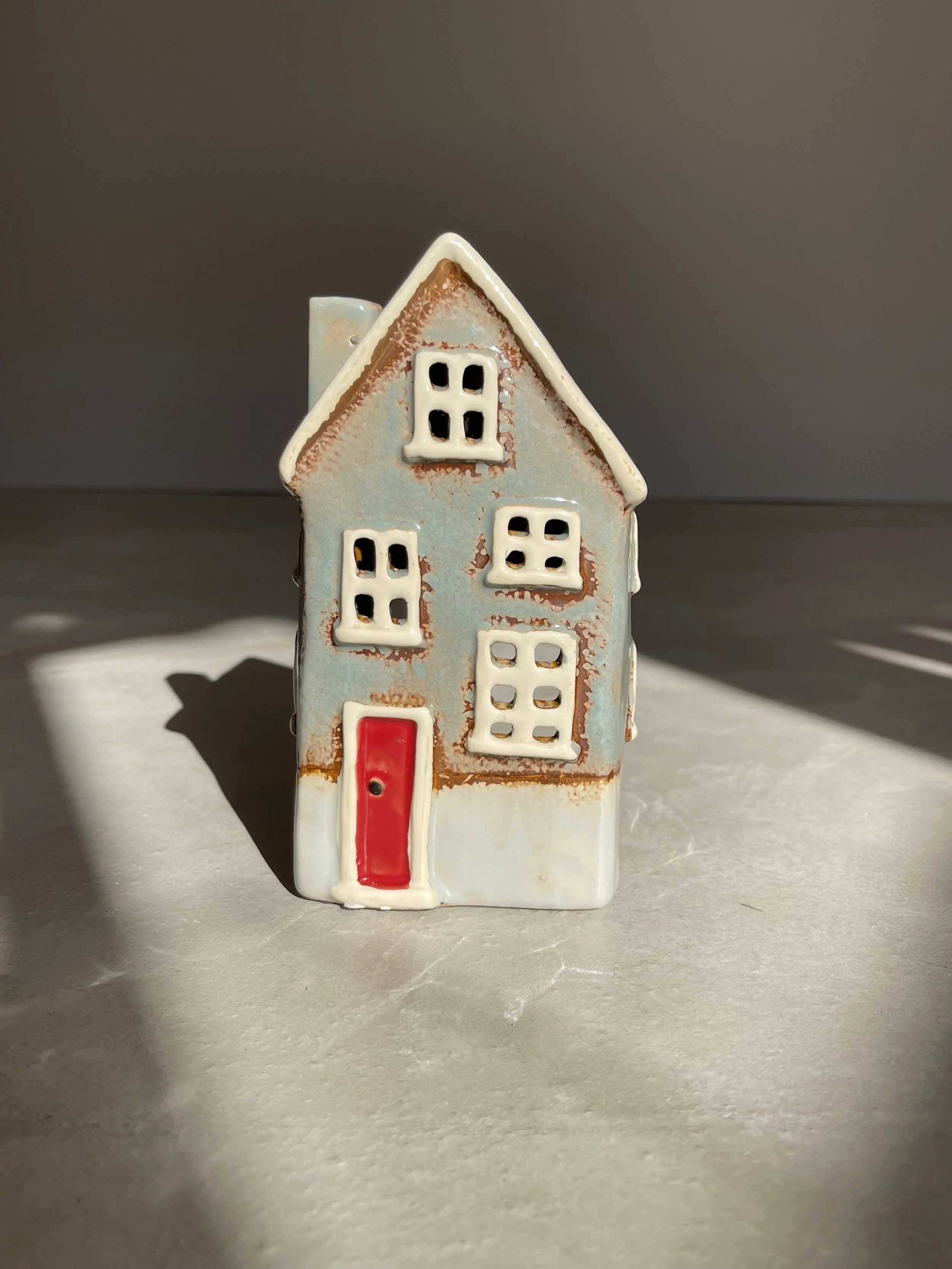 Grey and red ceramic house