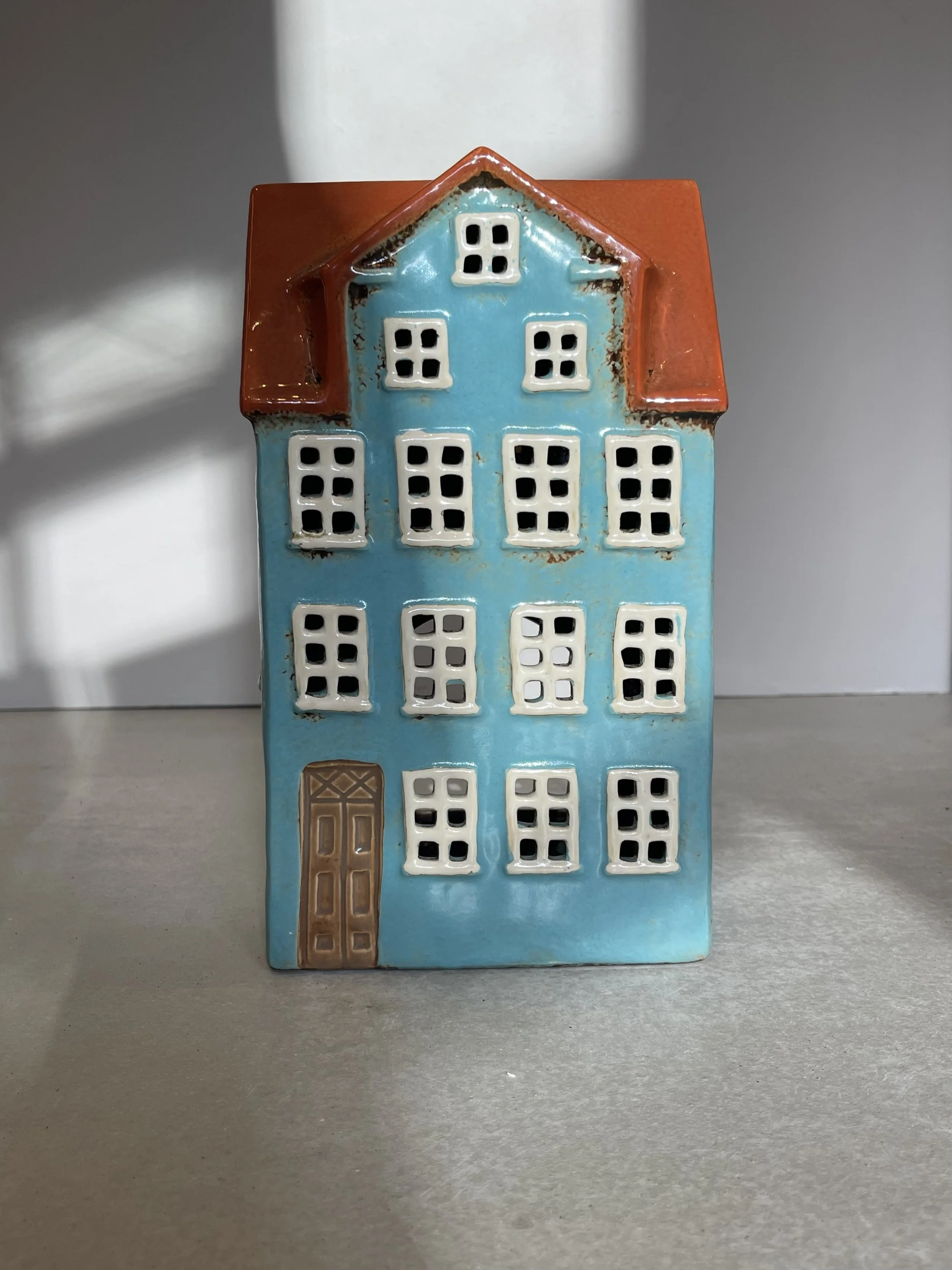 Large blue ceramic house