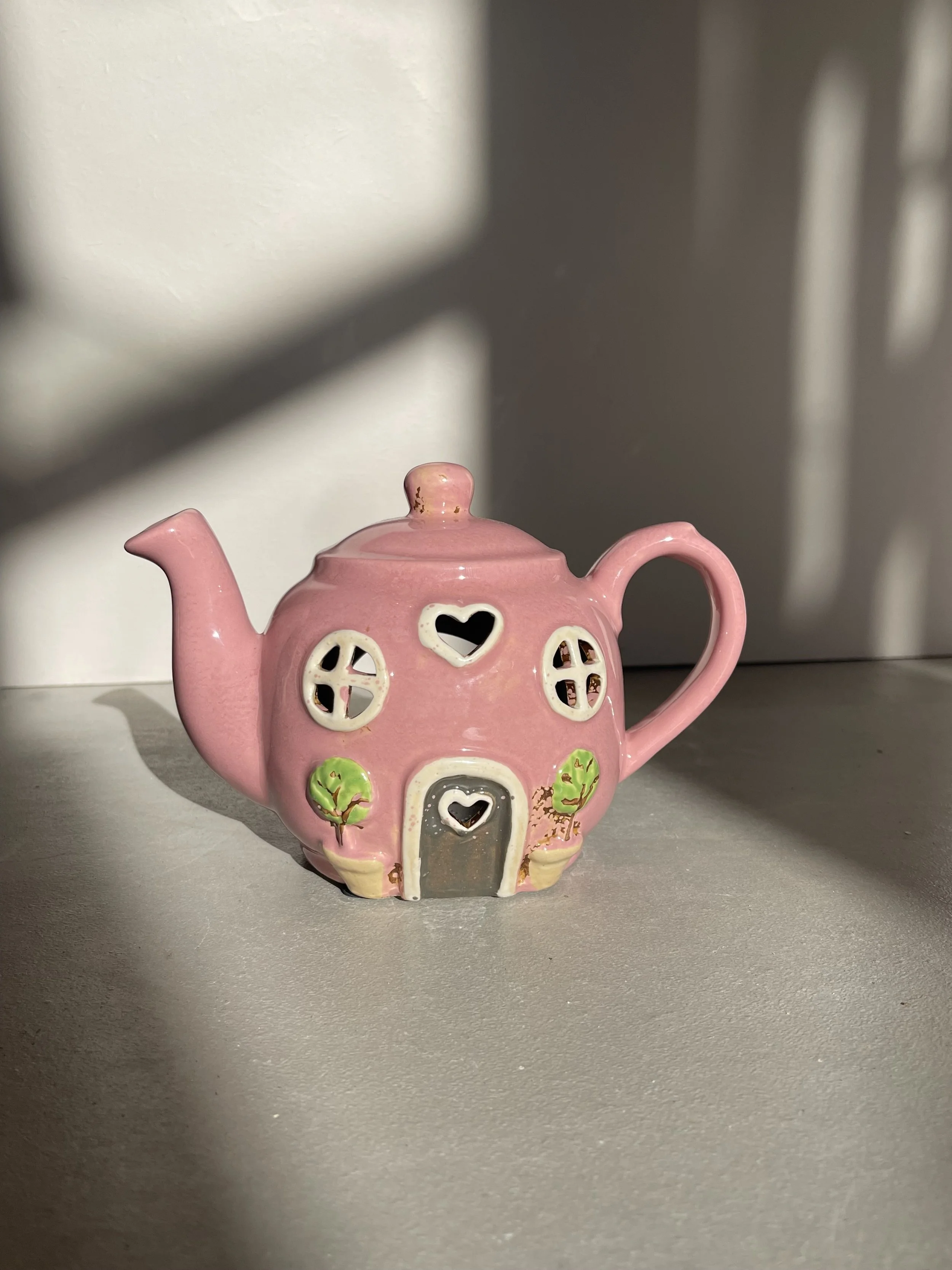 Pink teapot ceramic house