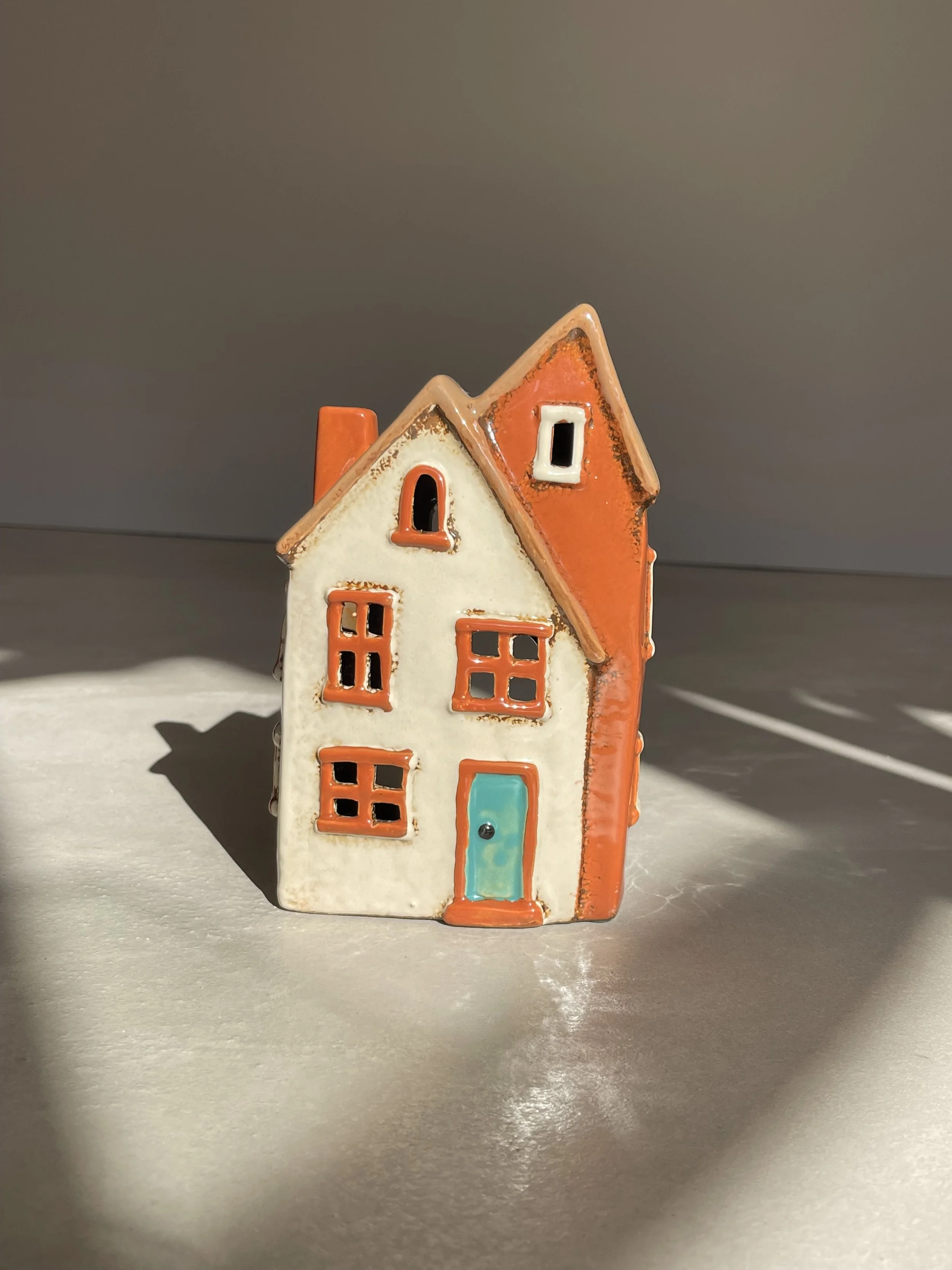 Brown and cream ceramic house