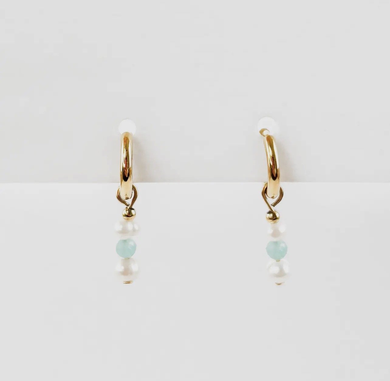 White and blue gemstone huggie hoop earrings