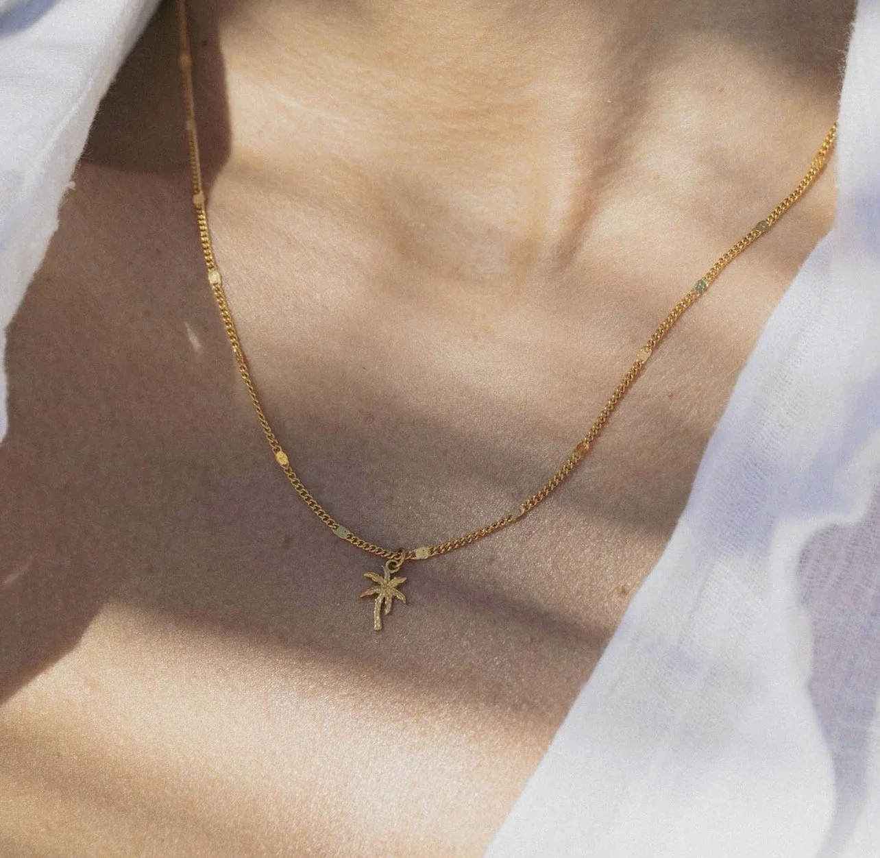 Pãlima tree gold charm necklace