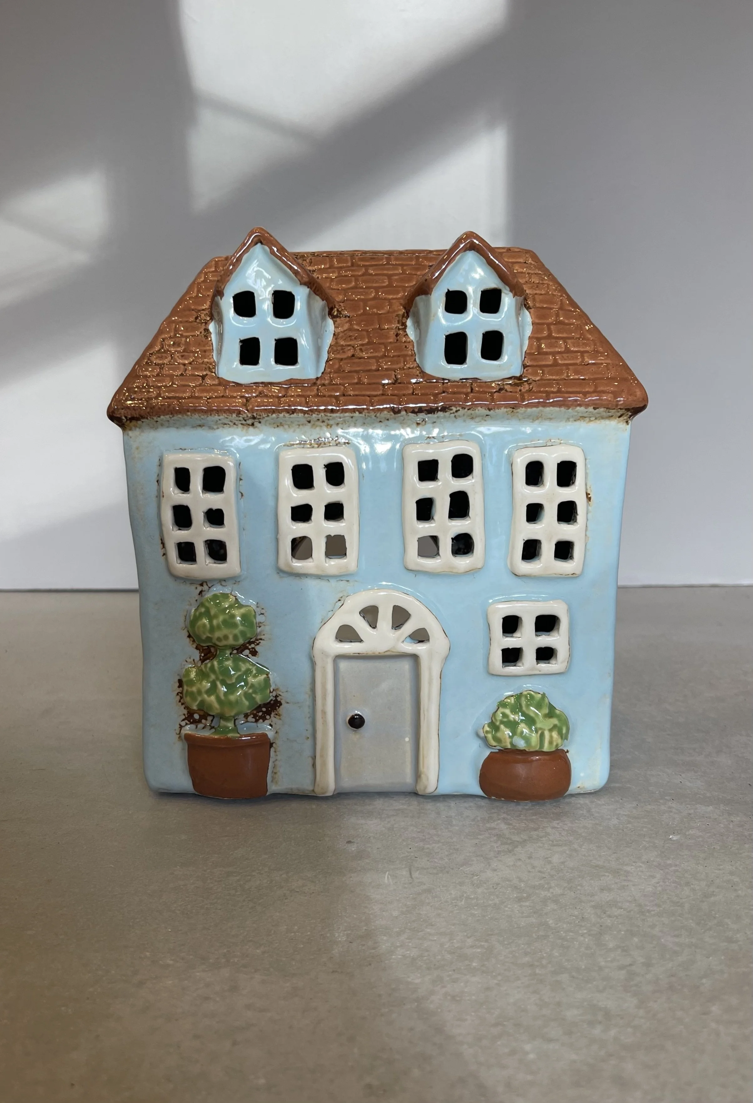 Pale blue ceramic house