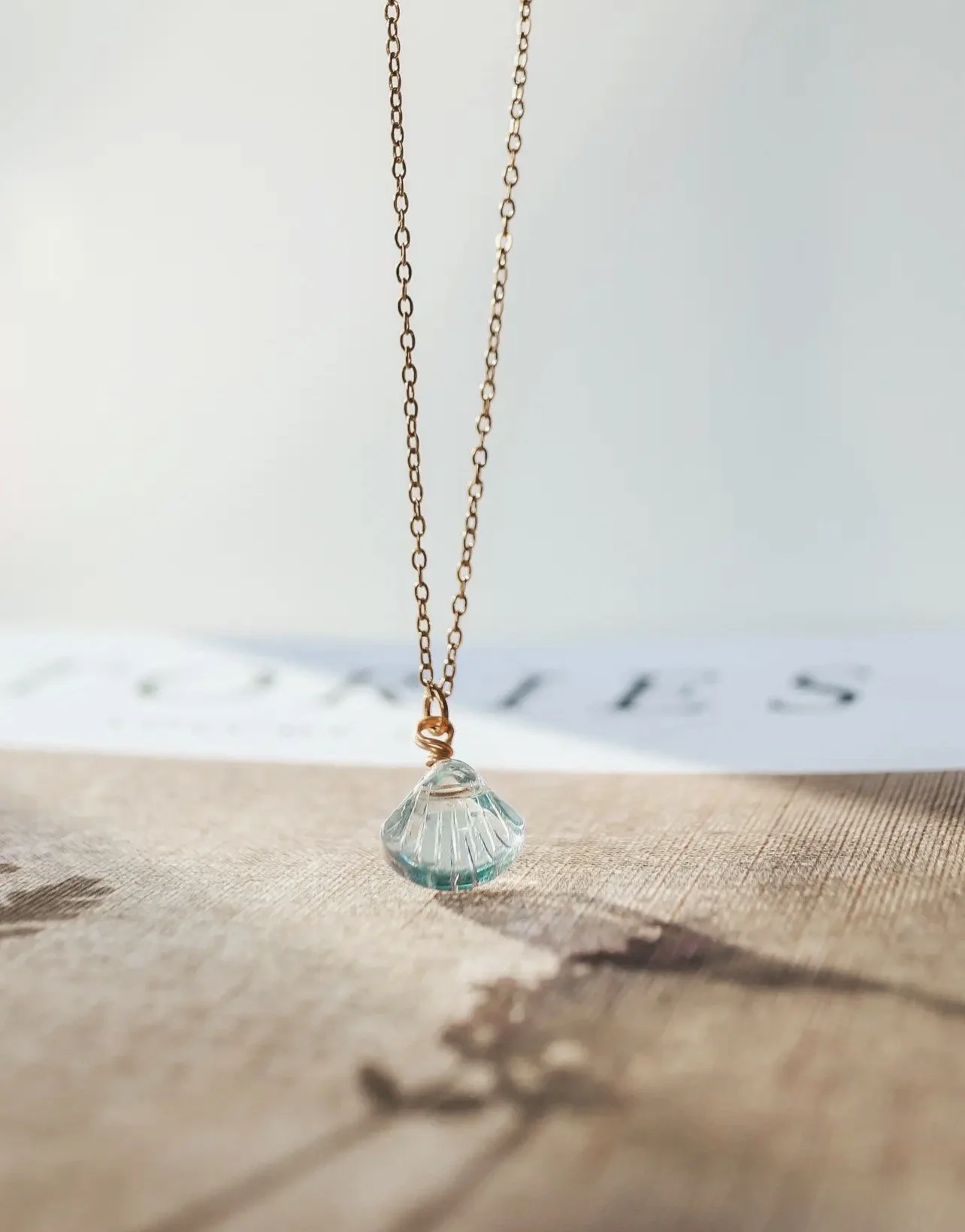 Blue glass shell pendant necklace
