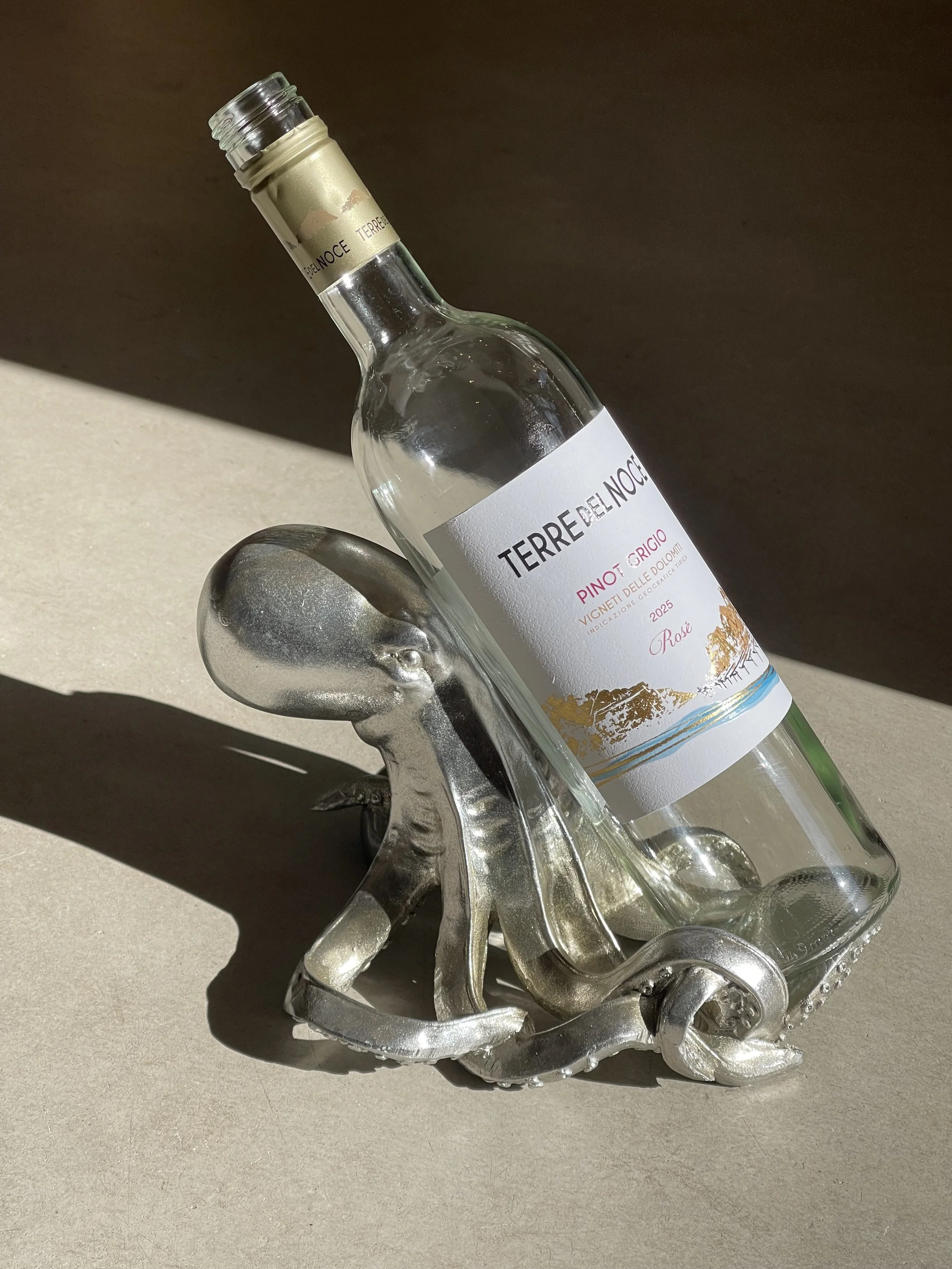 Silver octopus wine bottle holder perfect for coastal decor and quirky homeware. Avilable in Ruby's Designs giftshop in Looe, Cornwall.