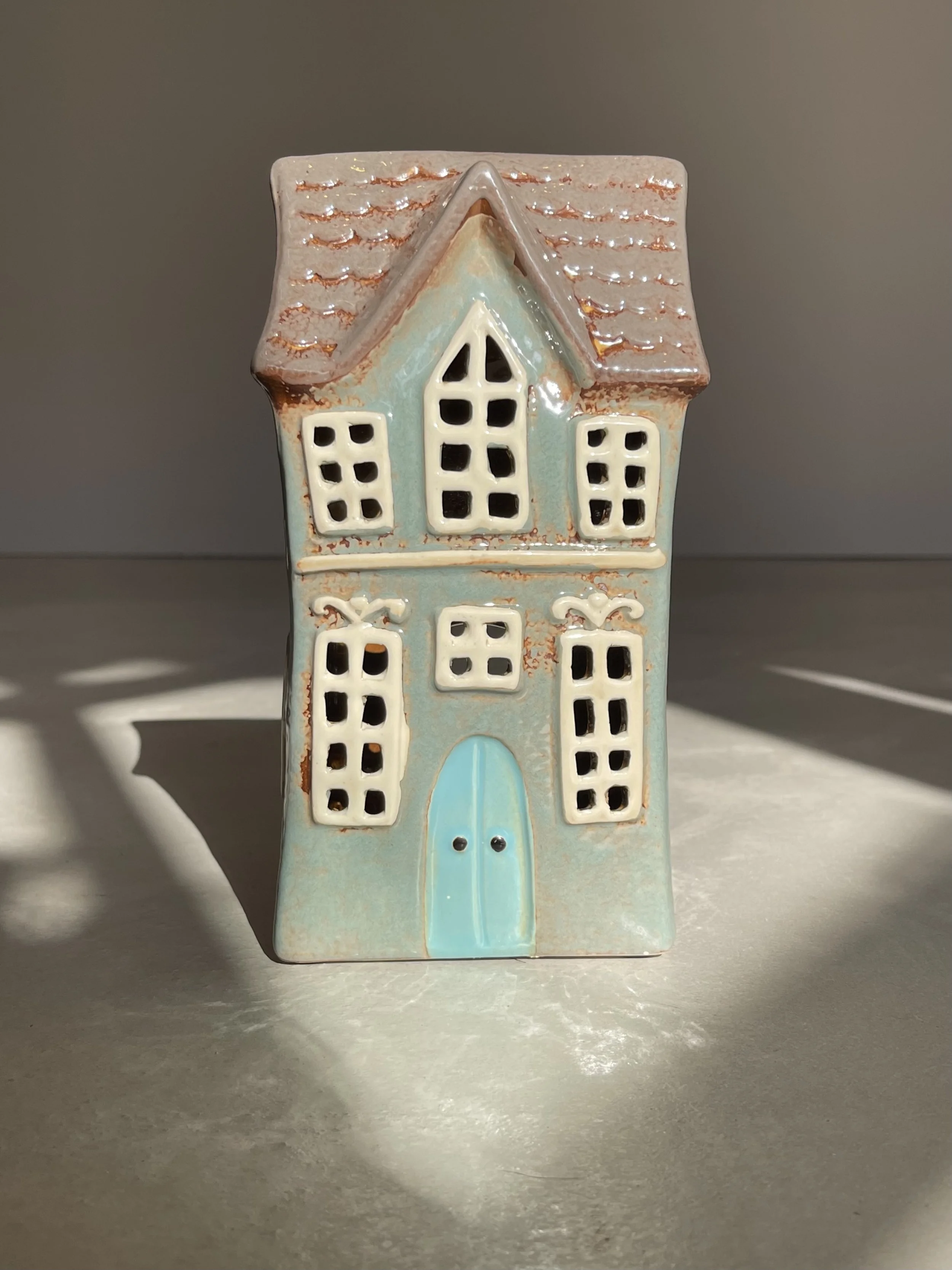 Grey and blue ceramic house