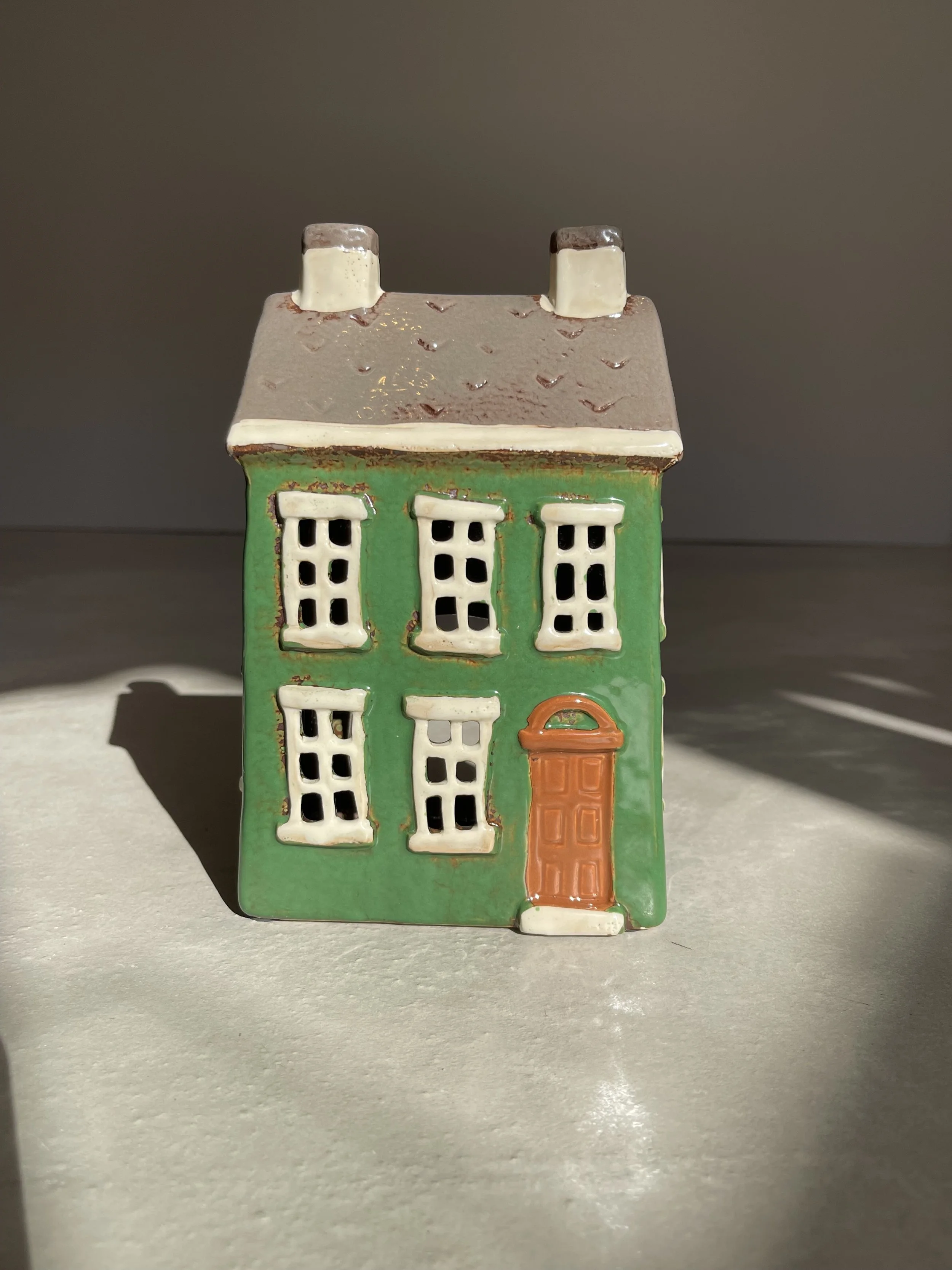 Dark green ceramic house