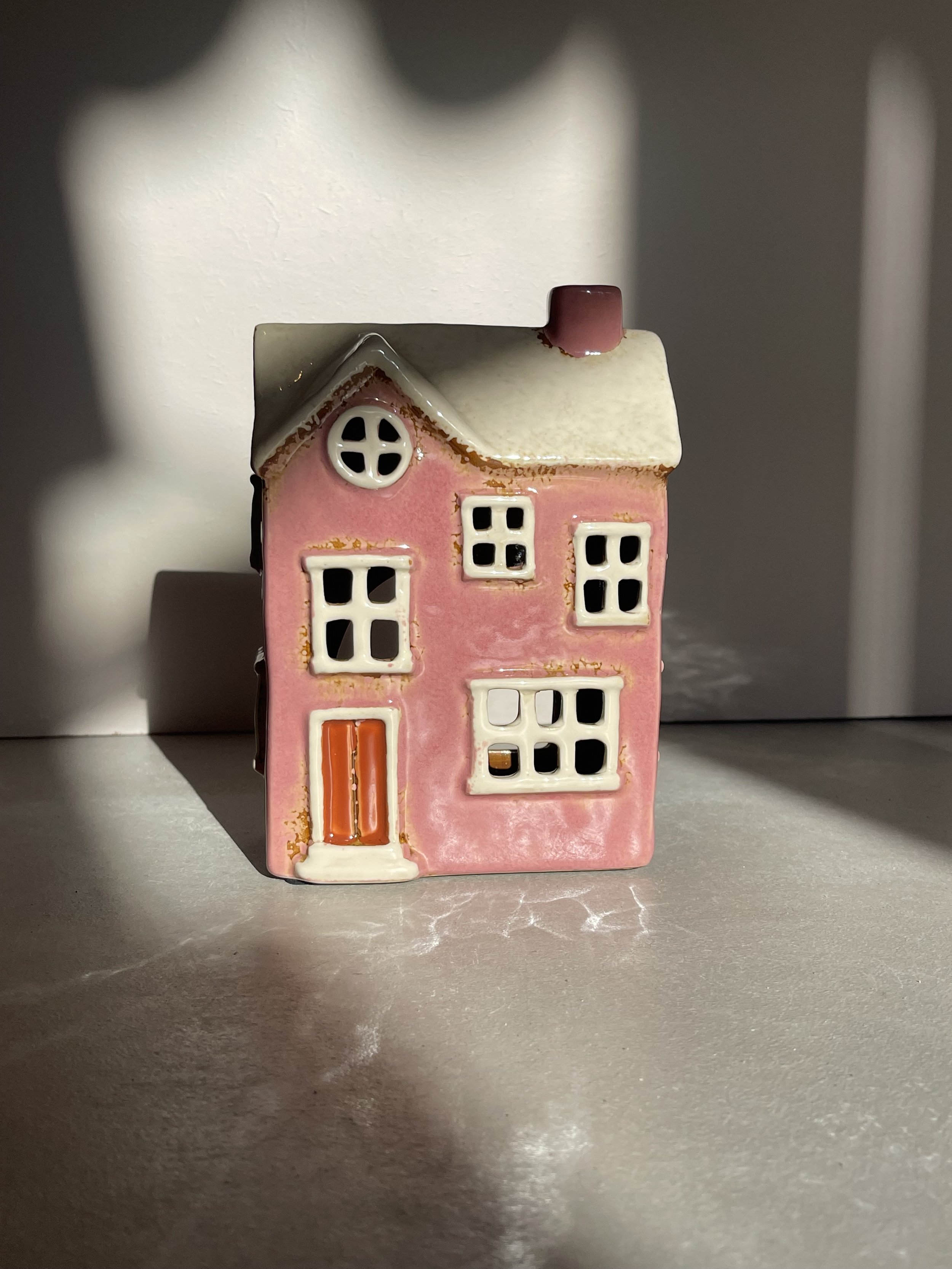 Pink ceramic house tea light holder
