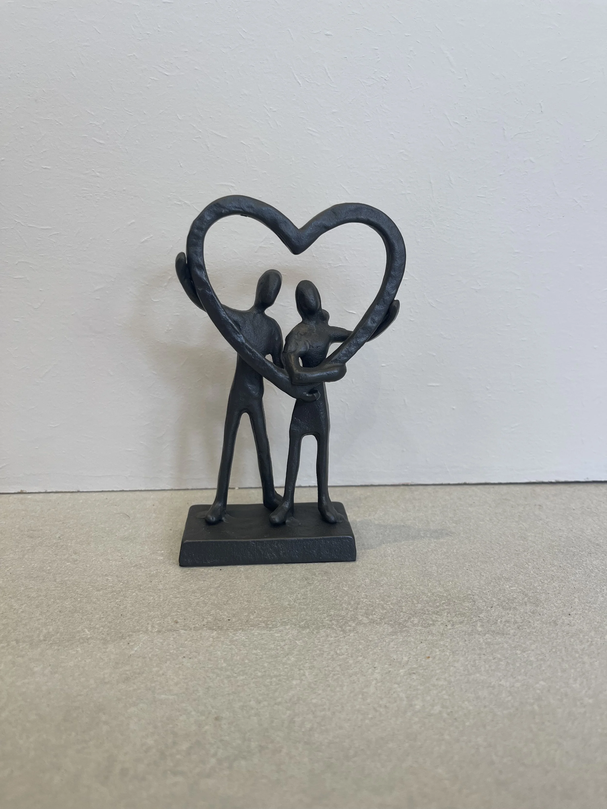 Metal couple in heart