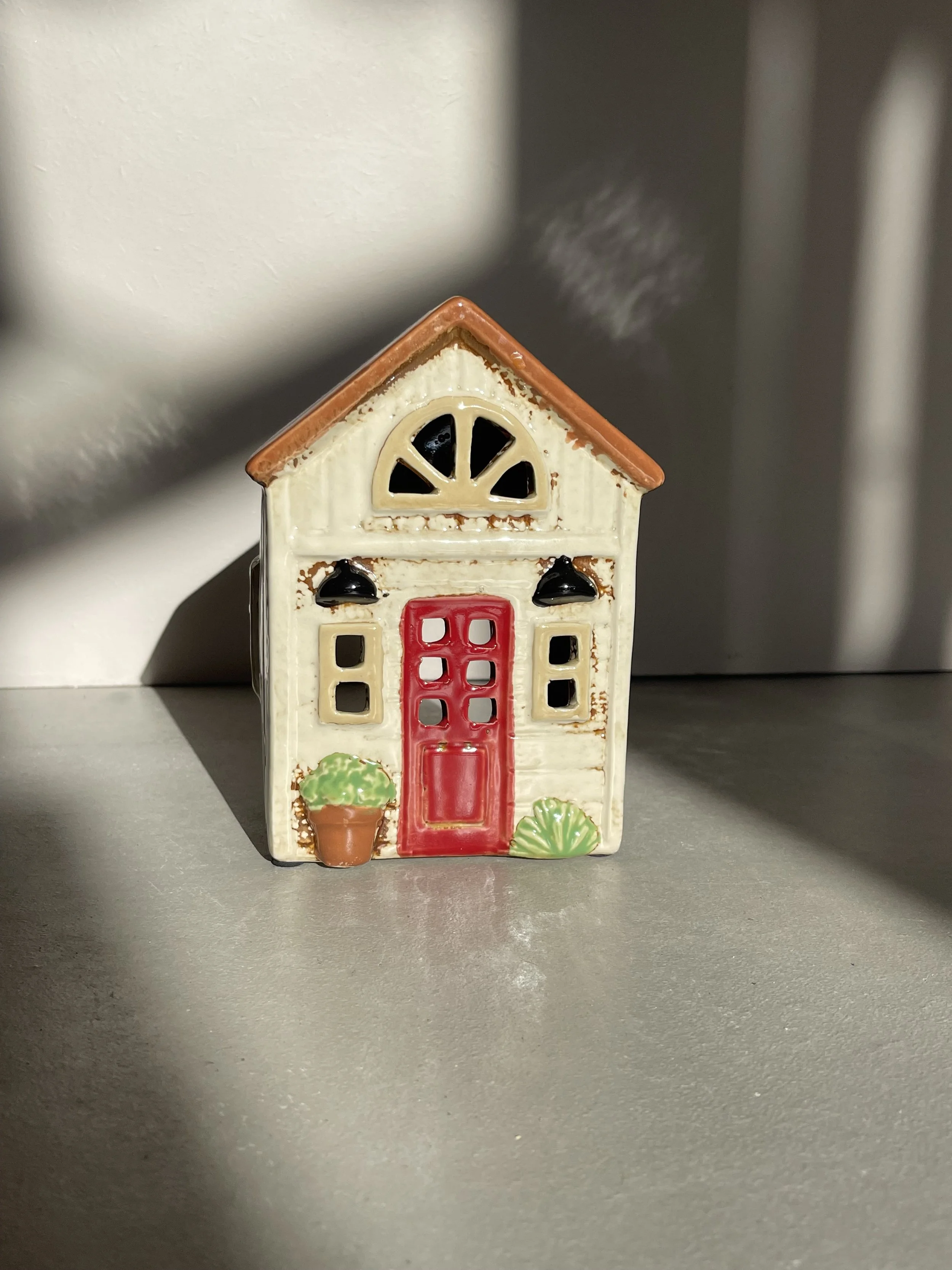 Cream rustic ceramic house red door