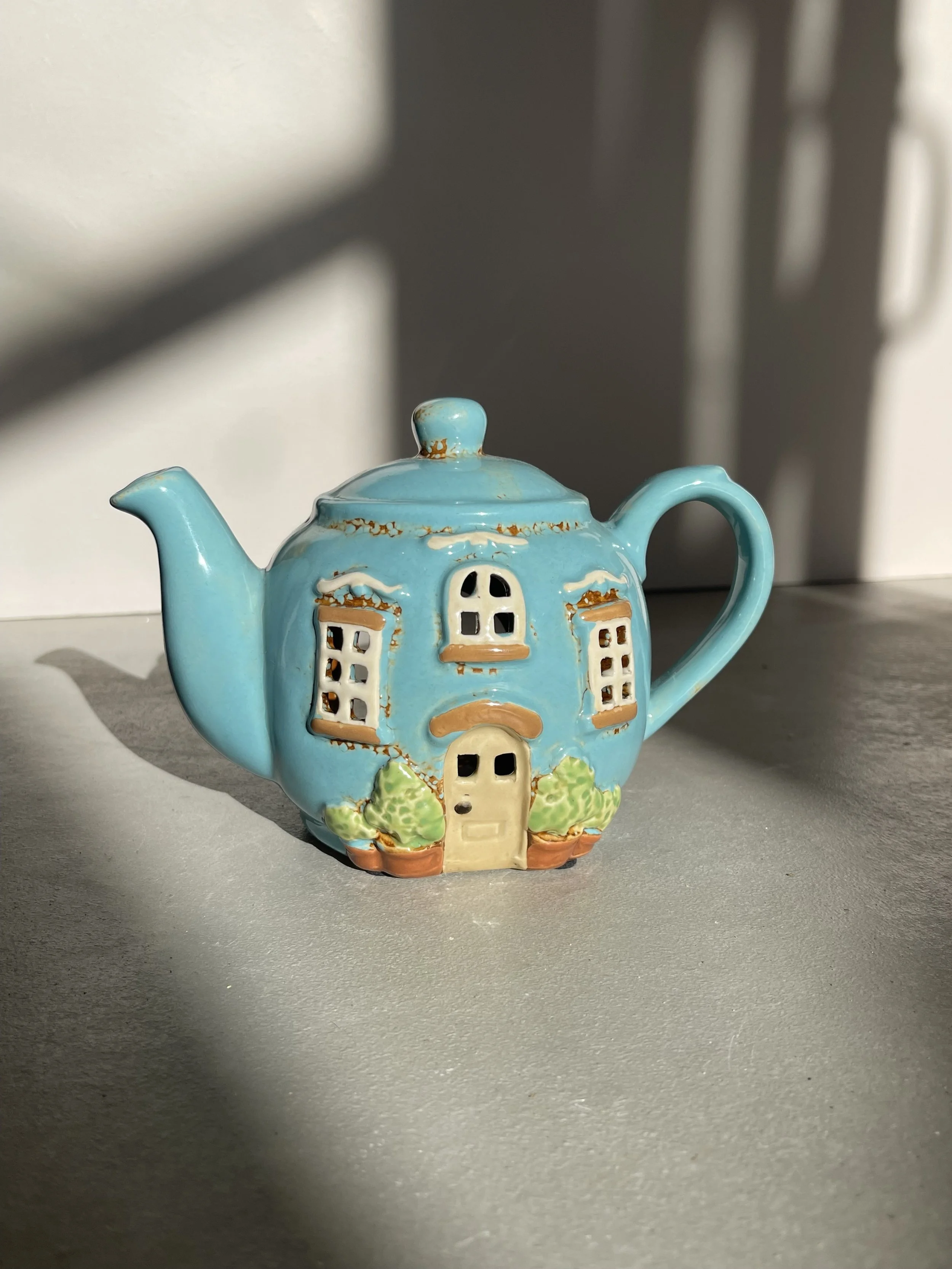 Blue teapot ceramic house