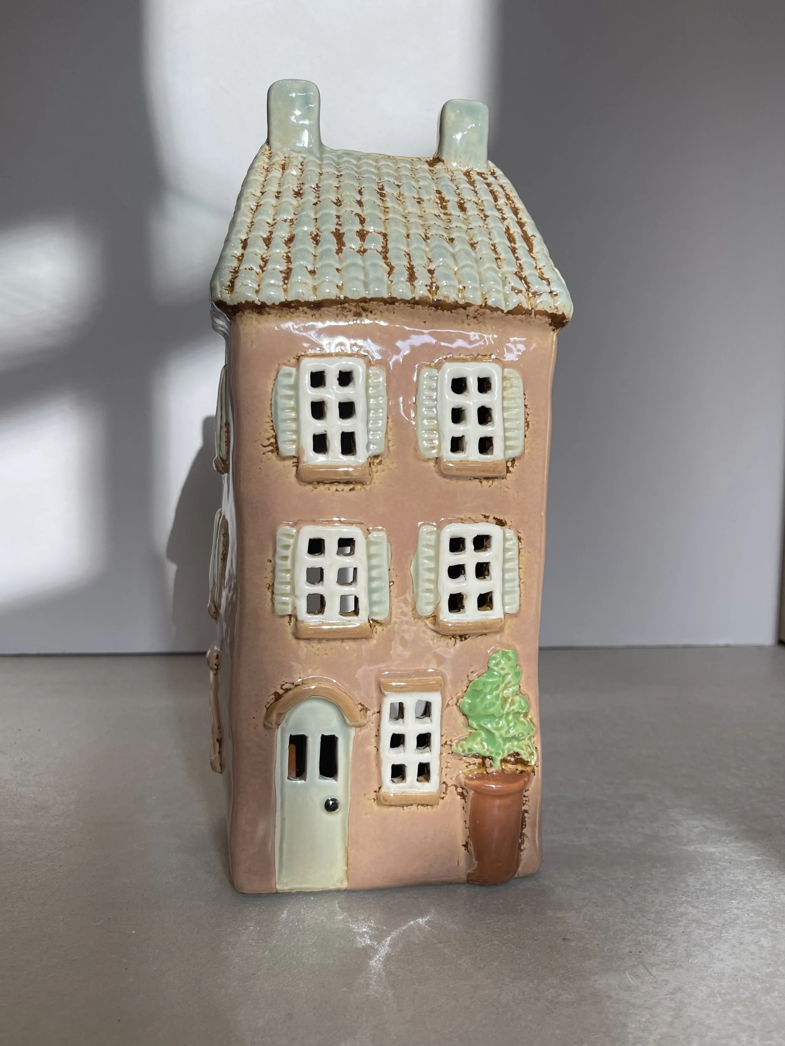 Tall pink ceramic house