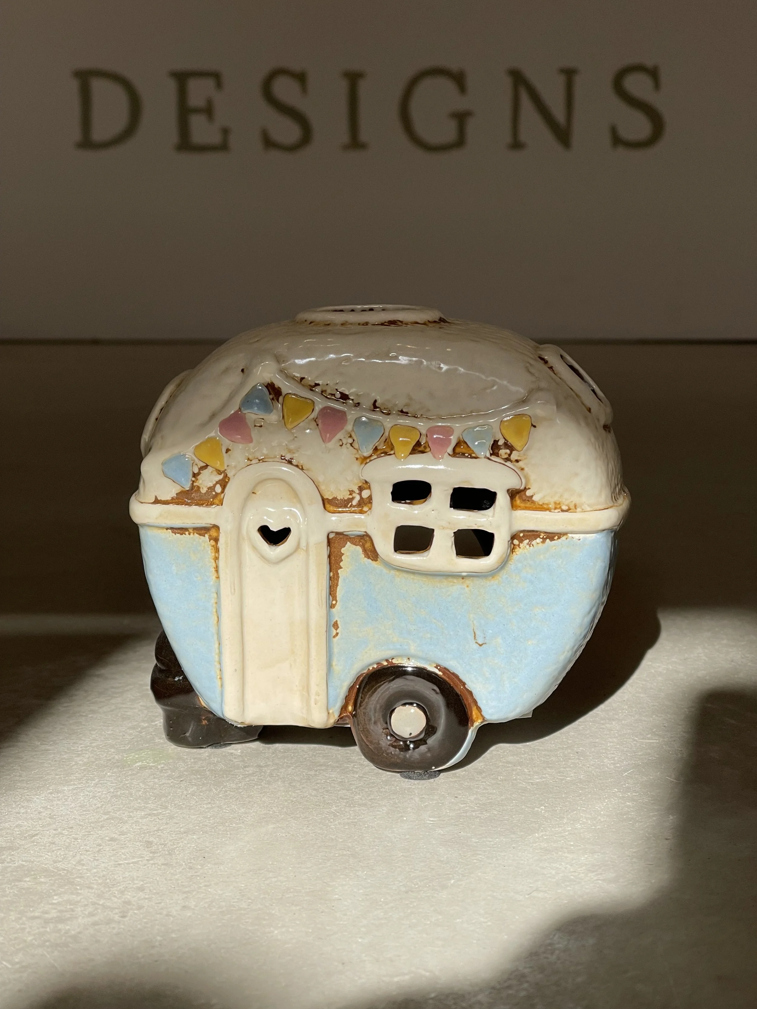 Blue and white bunting ceramic camper van