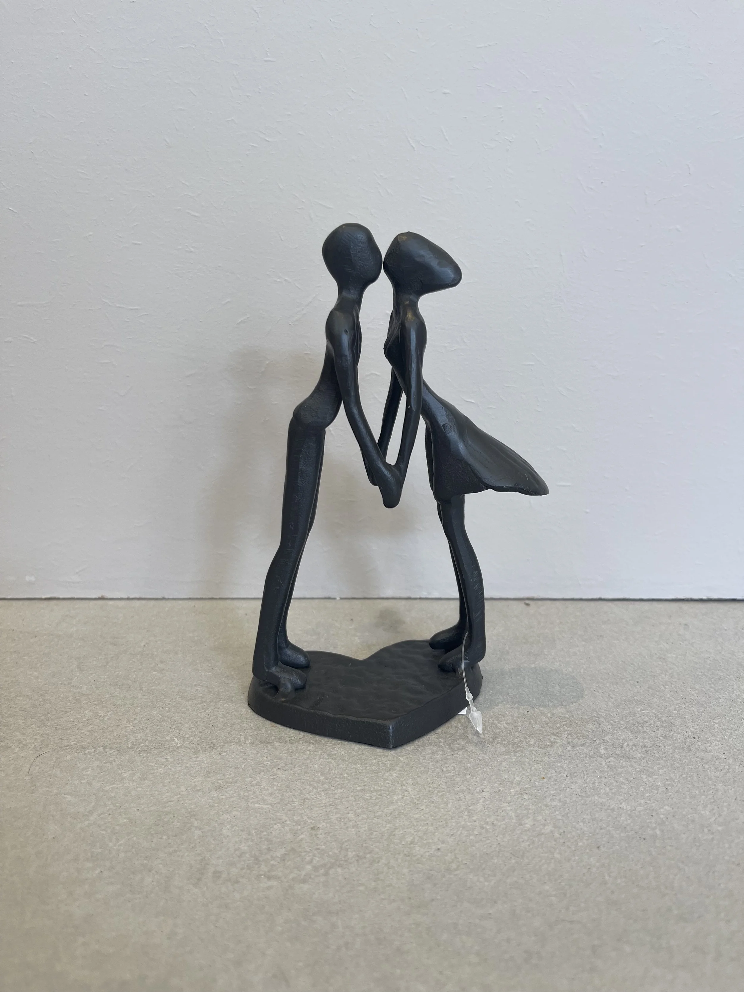 Metal couple kissing heart