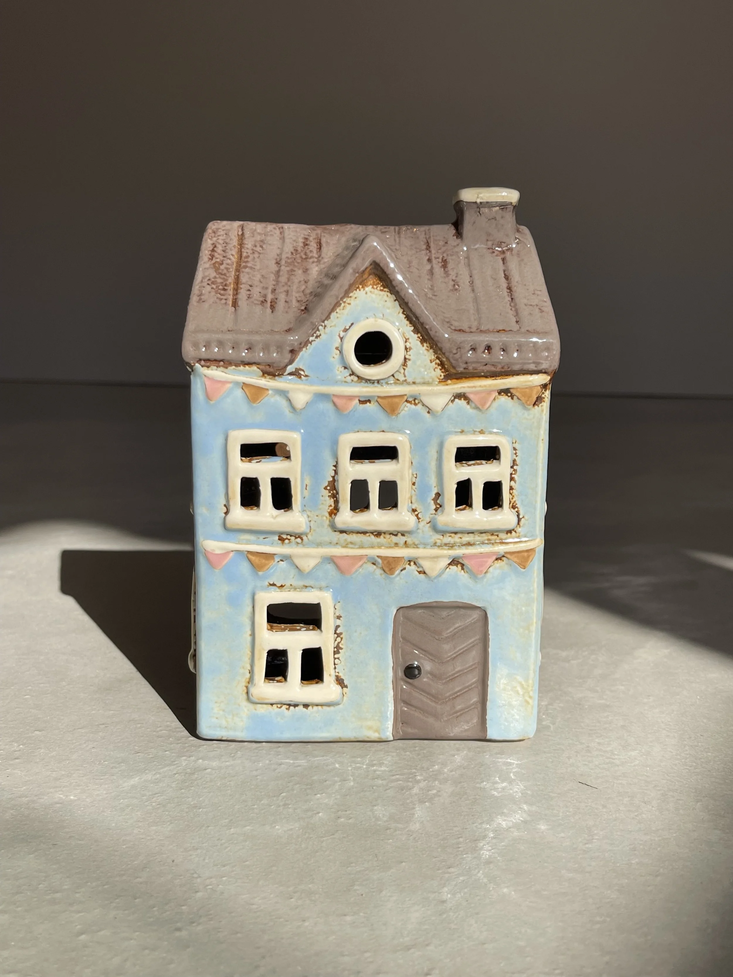 Blue bunting ceramic house