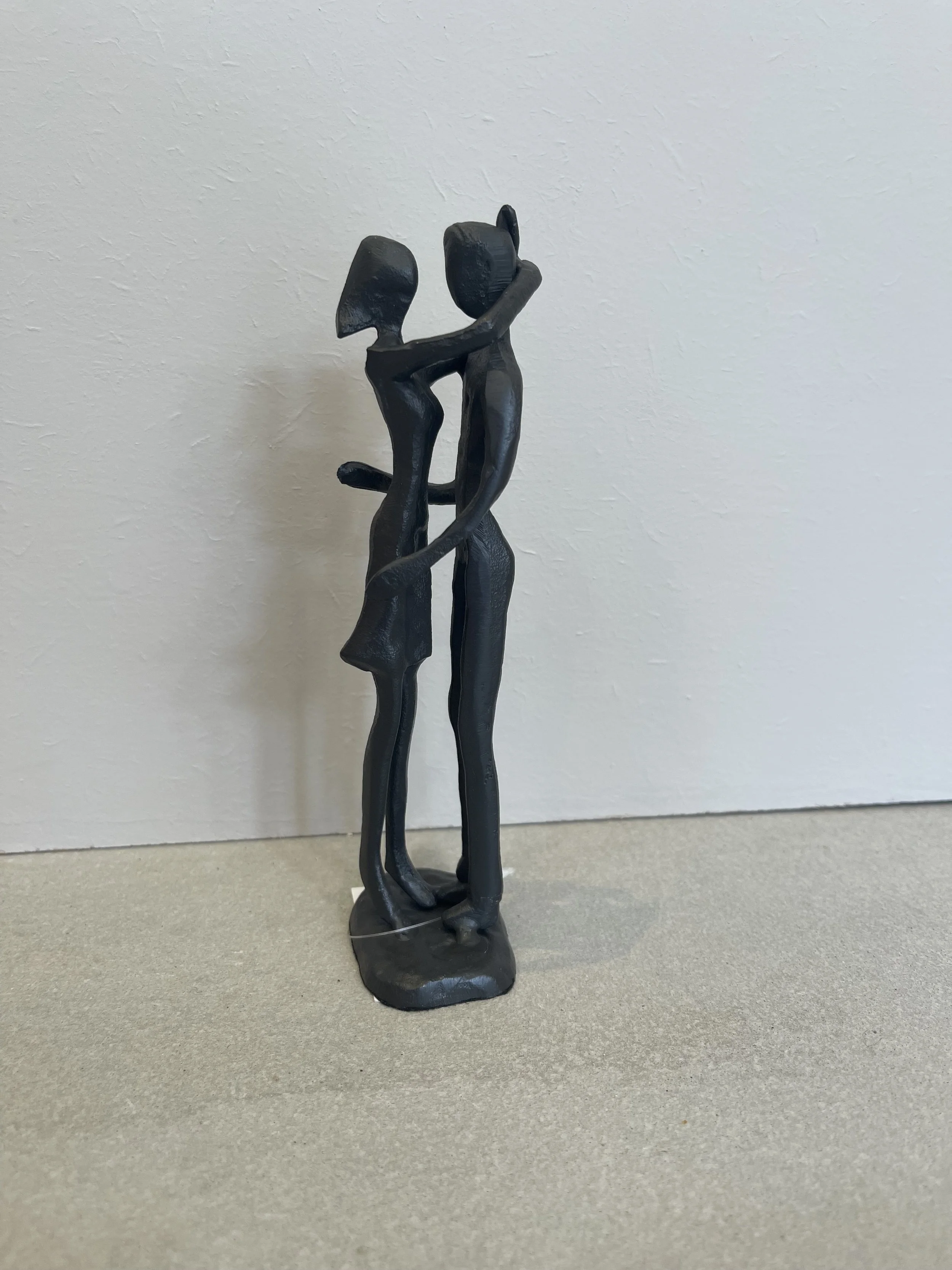 Metal couple hugging