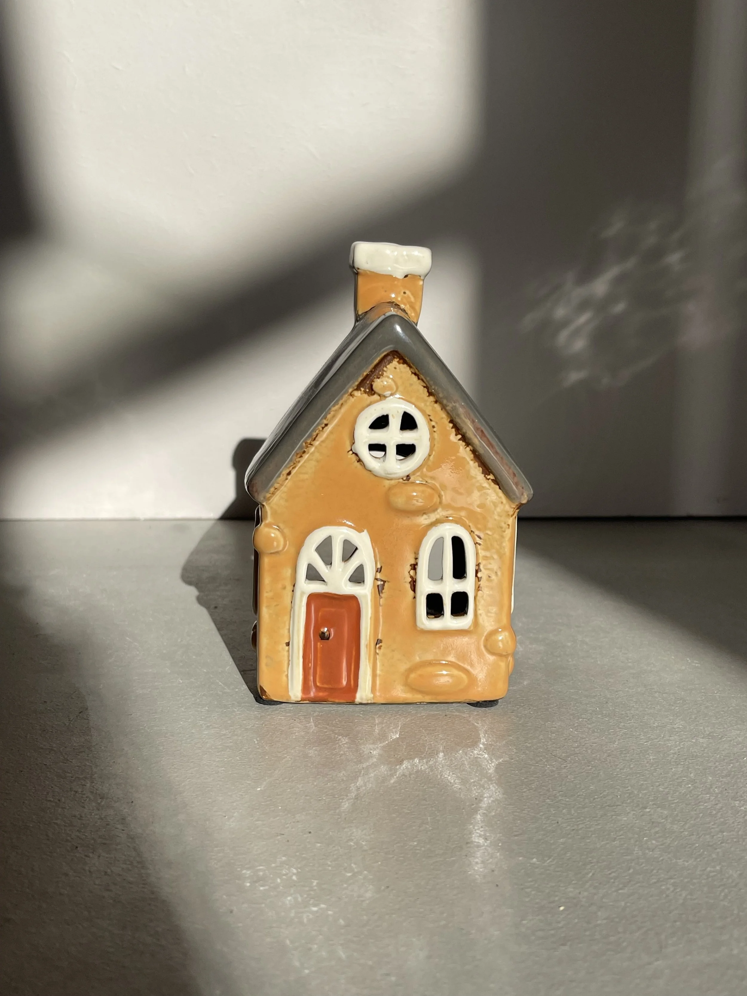 Ochre yellow ceramic house