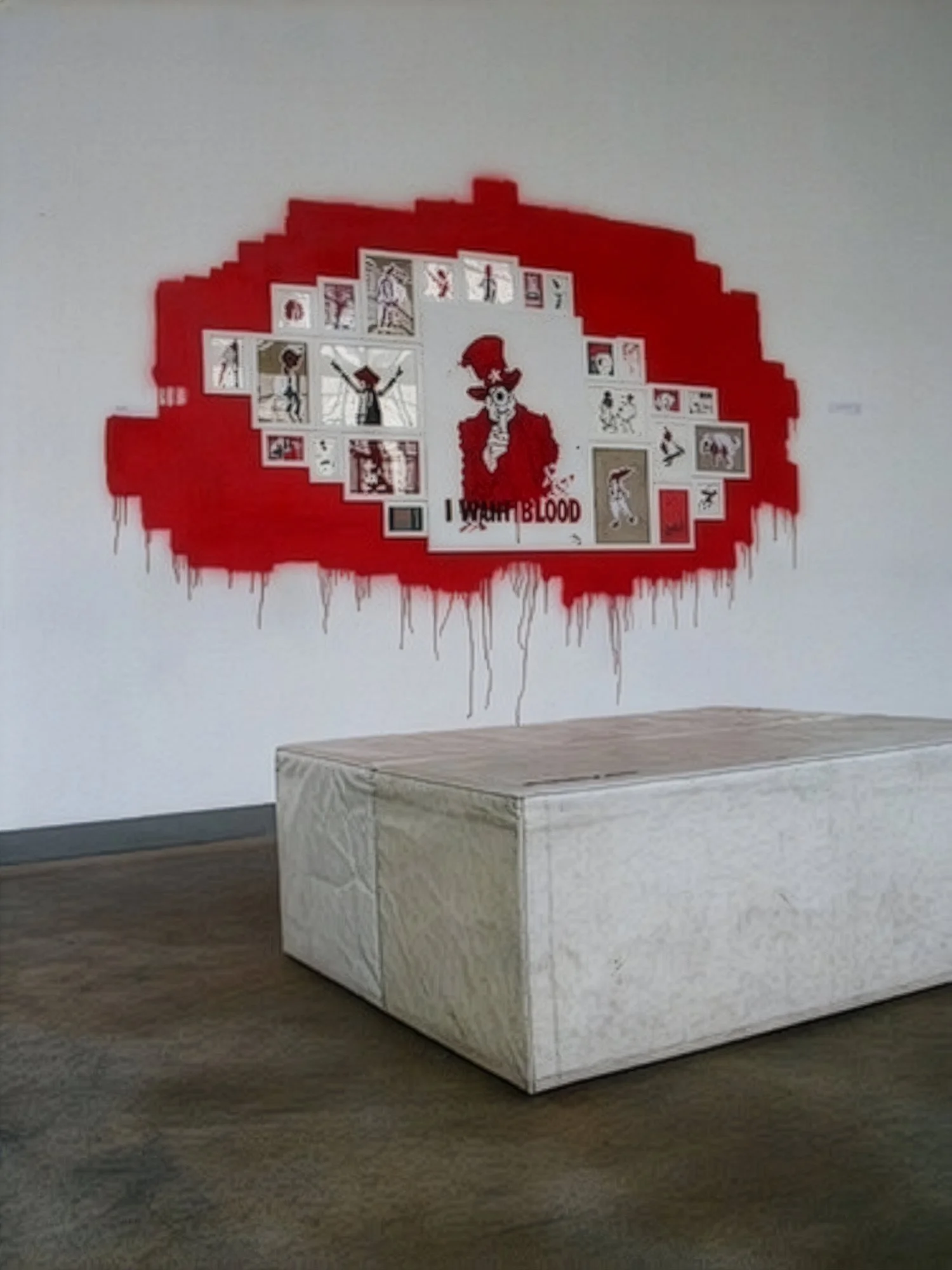 Gallery installation on a wall for the art show: The 2nd amendment, featuring various illustrations and paintings from the artist Merlin Zuni.