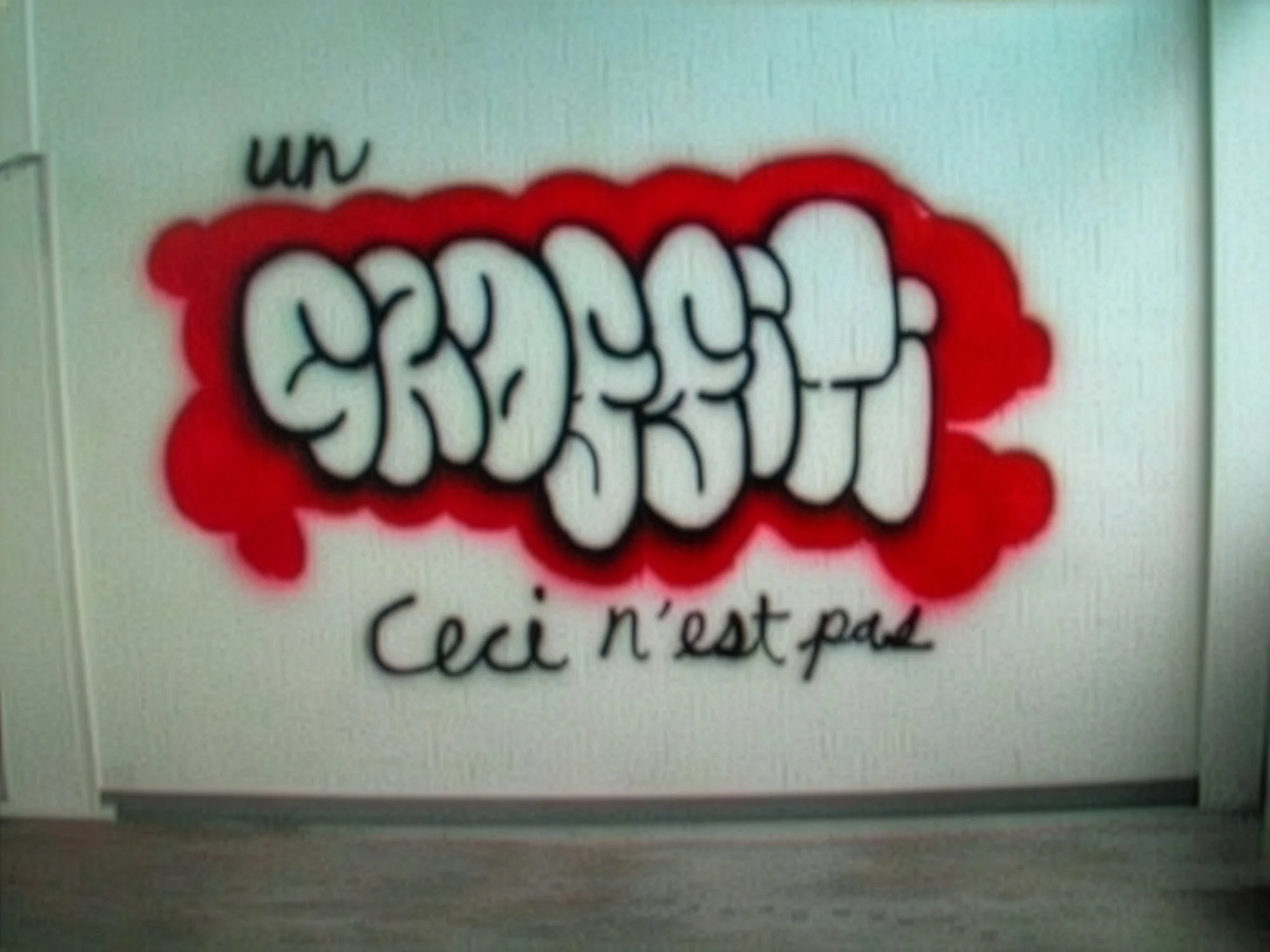 Art Title - Ceci n'est pas' une Graffiti, Merlin Zuni, a trompe l'oeil video installation where visitors see video footage of Merlin Spraying the same wall the image is being projected onto creating an illusion of live performance.