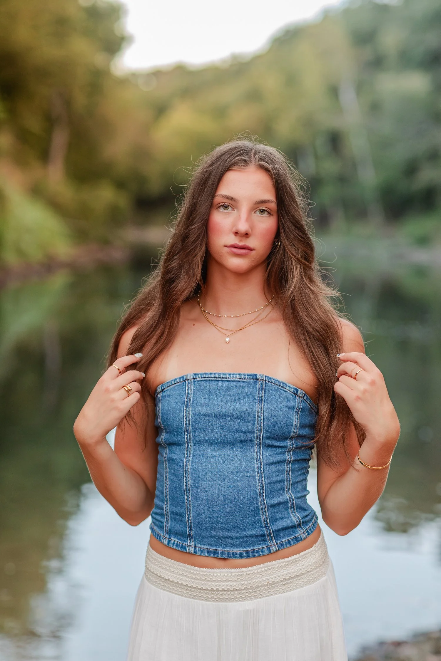Close portrait of Eisley in a denim top with the river behind her, Bolivar, MO