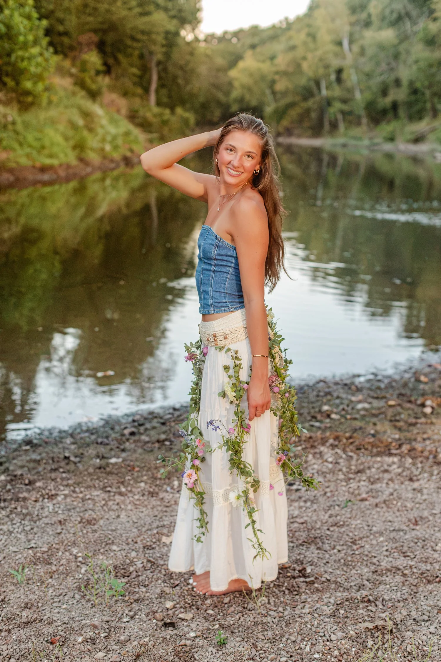 Eisley with a hand in her hair and a vine garland by the river, Bolivar, MO