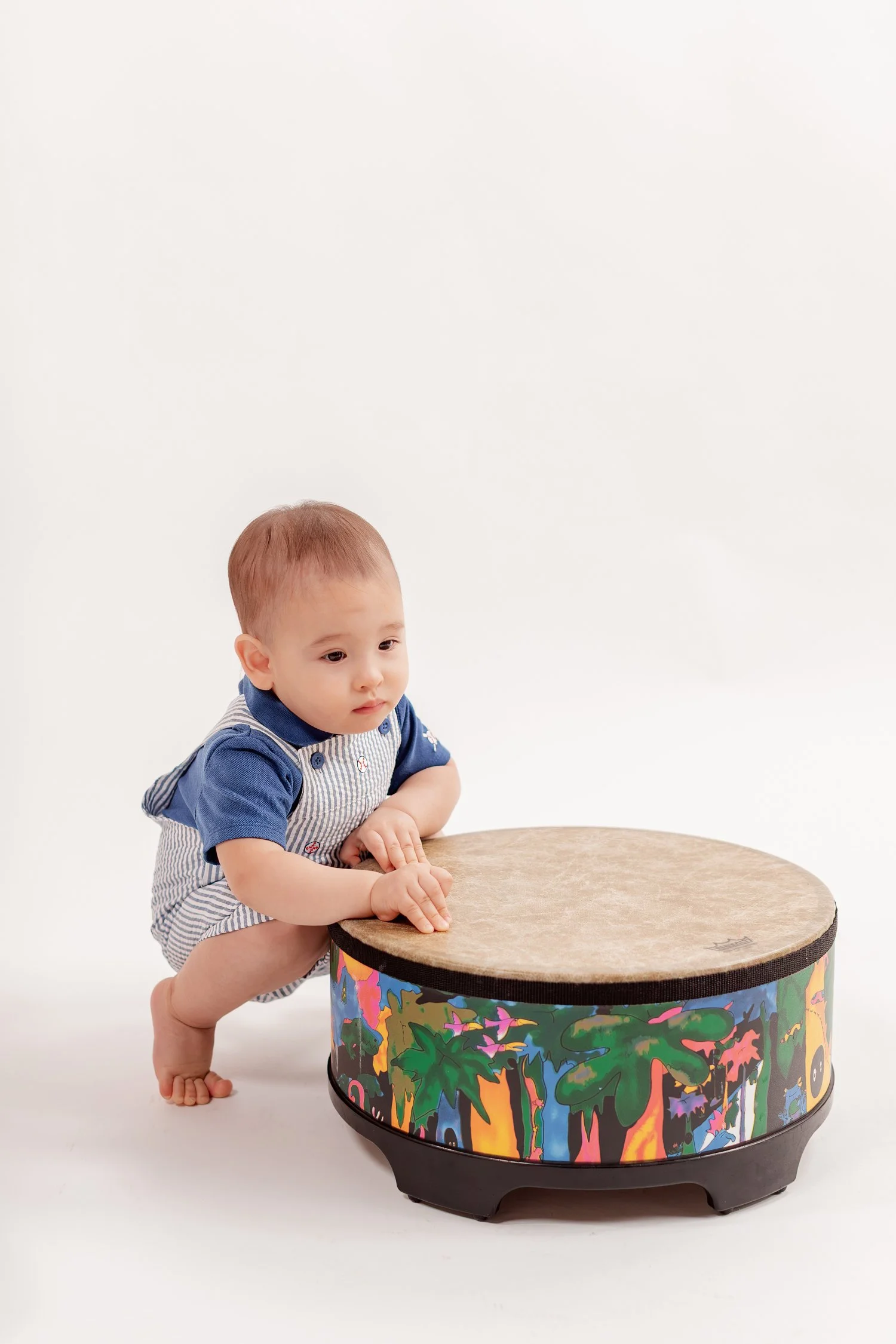 Winston crouching beside his drum