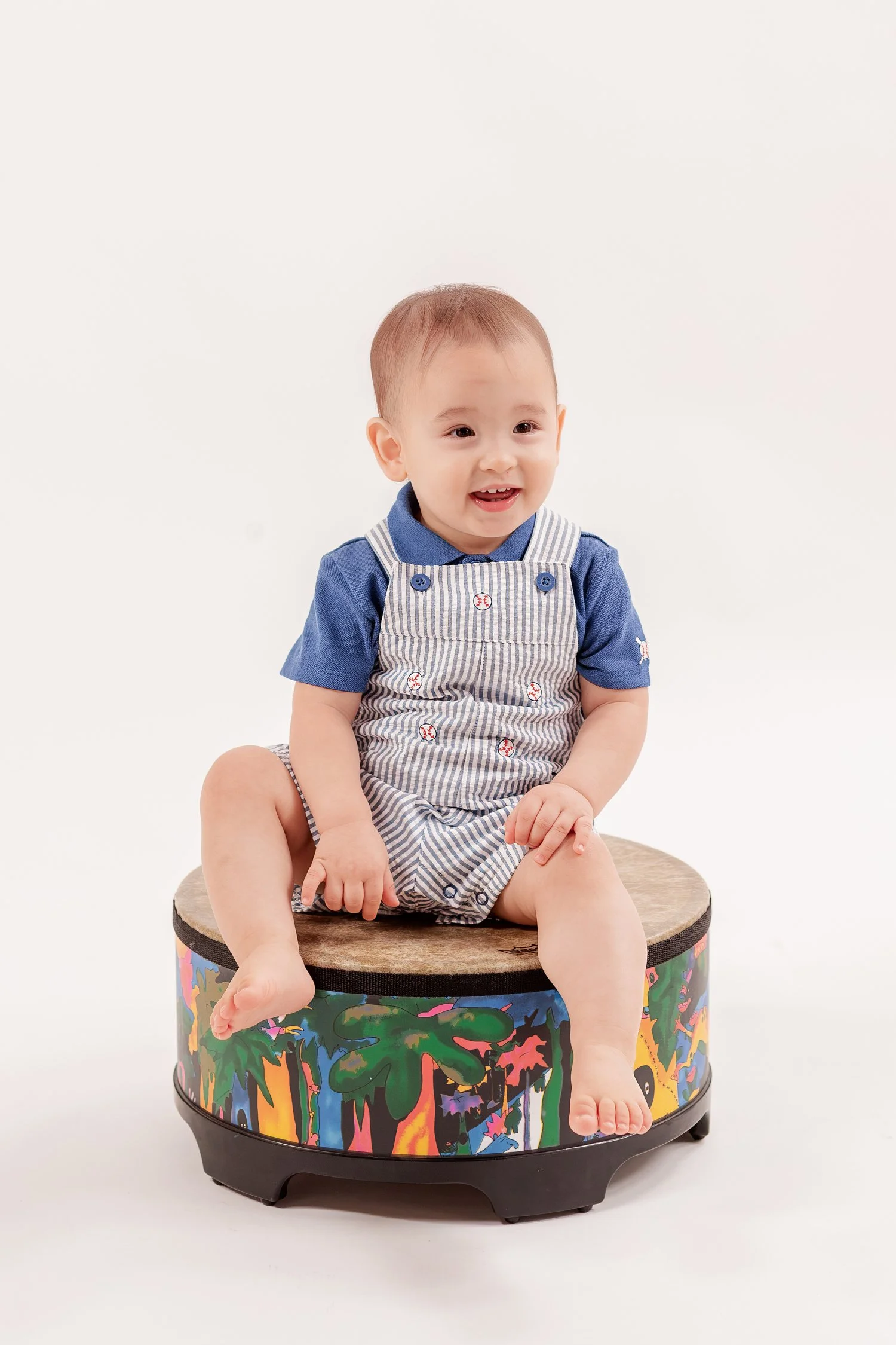 Winston smiling while sitting on his drum