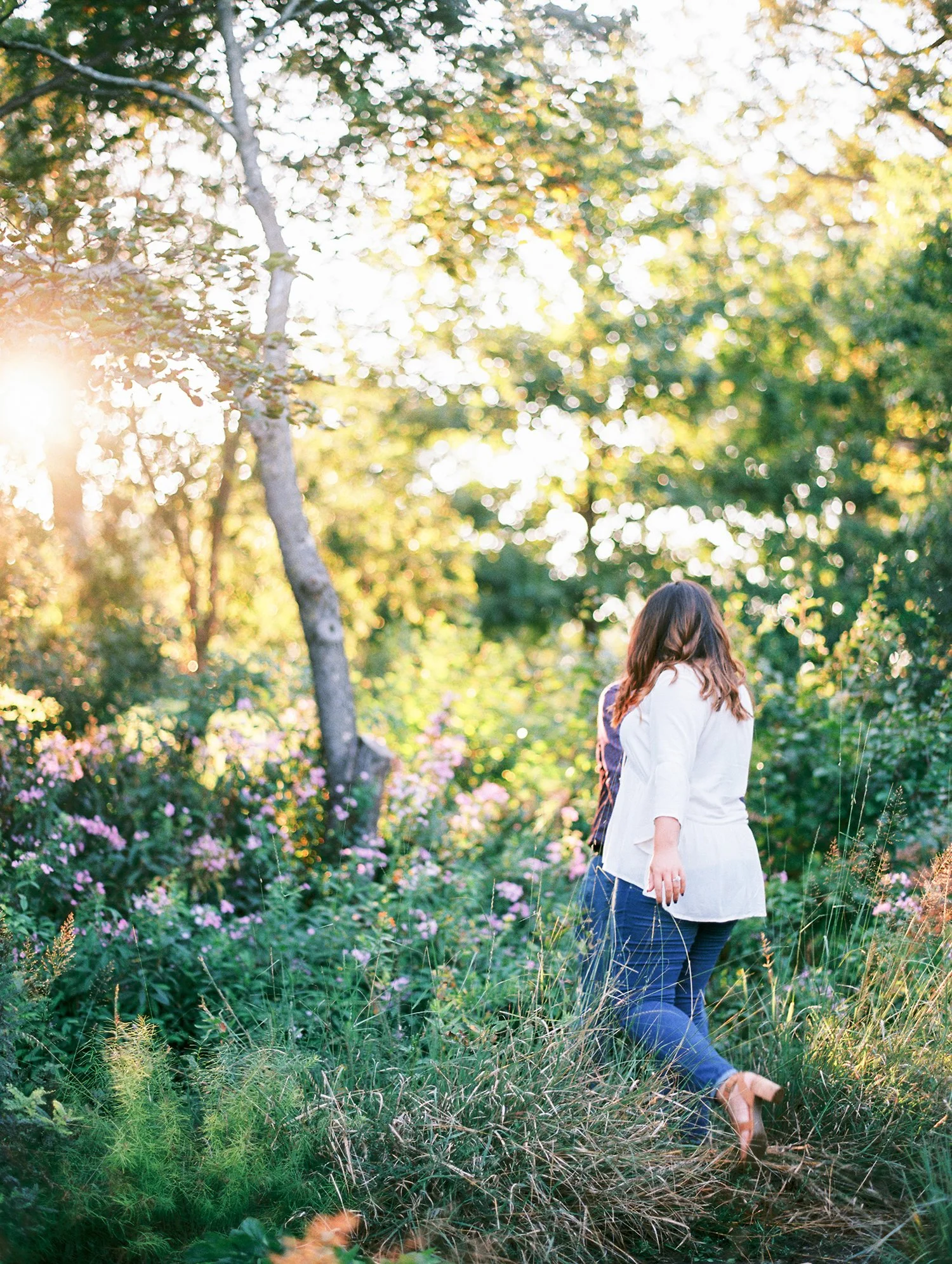 Sam walking through tall grass with Mike, Jordan Brittley Studio, Bolivar MO.