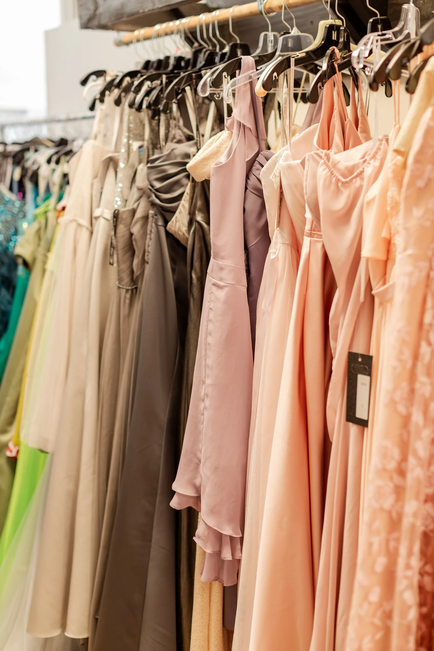 Dresses and tops hang on a clothing rack at H&H New Creations in Bolivar.