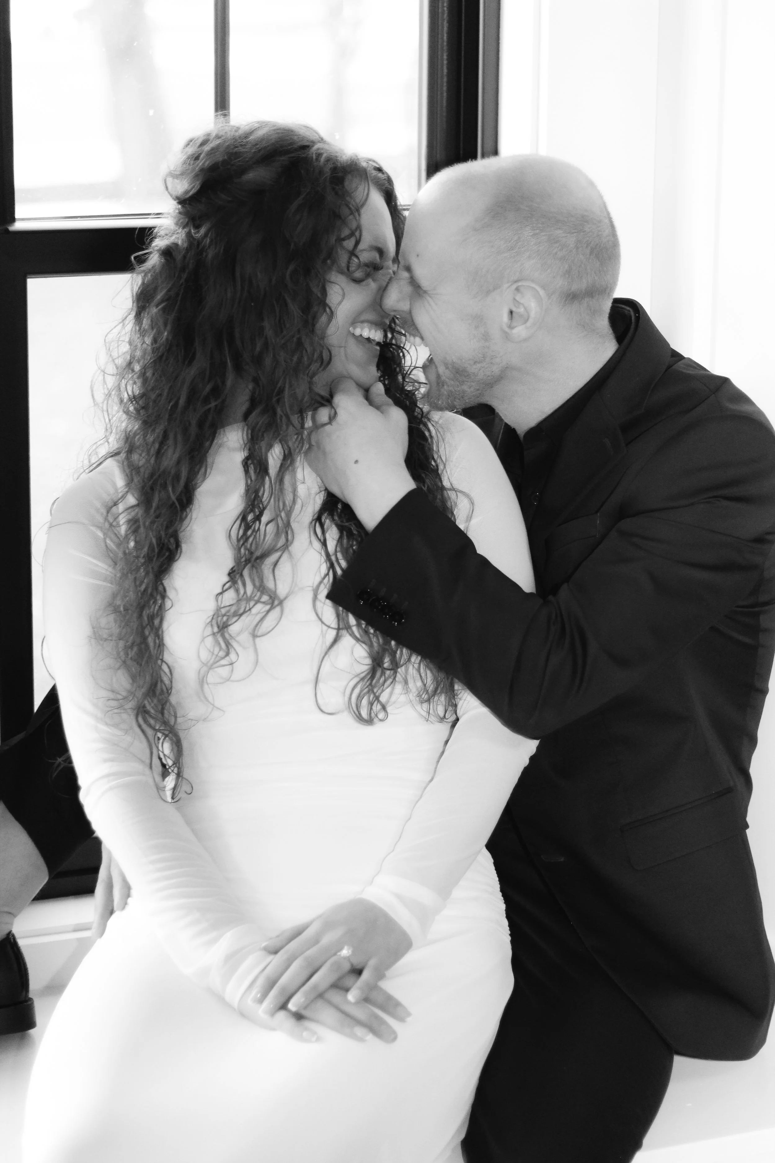Romantic and editorial photo of bride and groom in an Akron Ohio wedding venue.