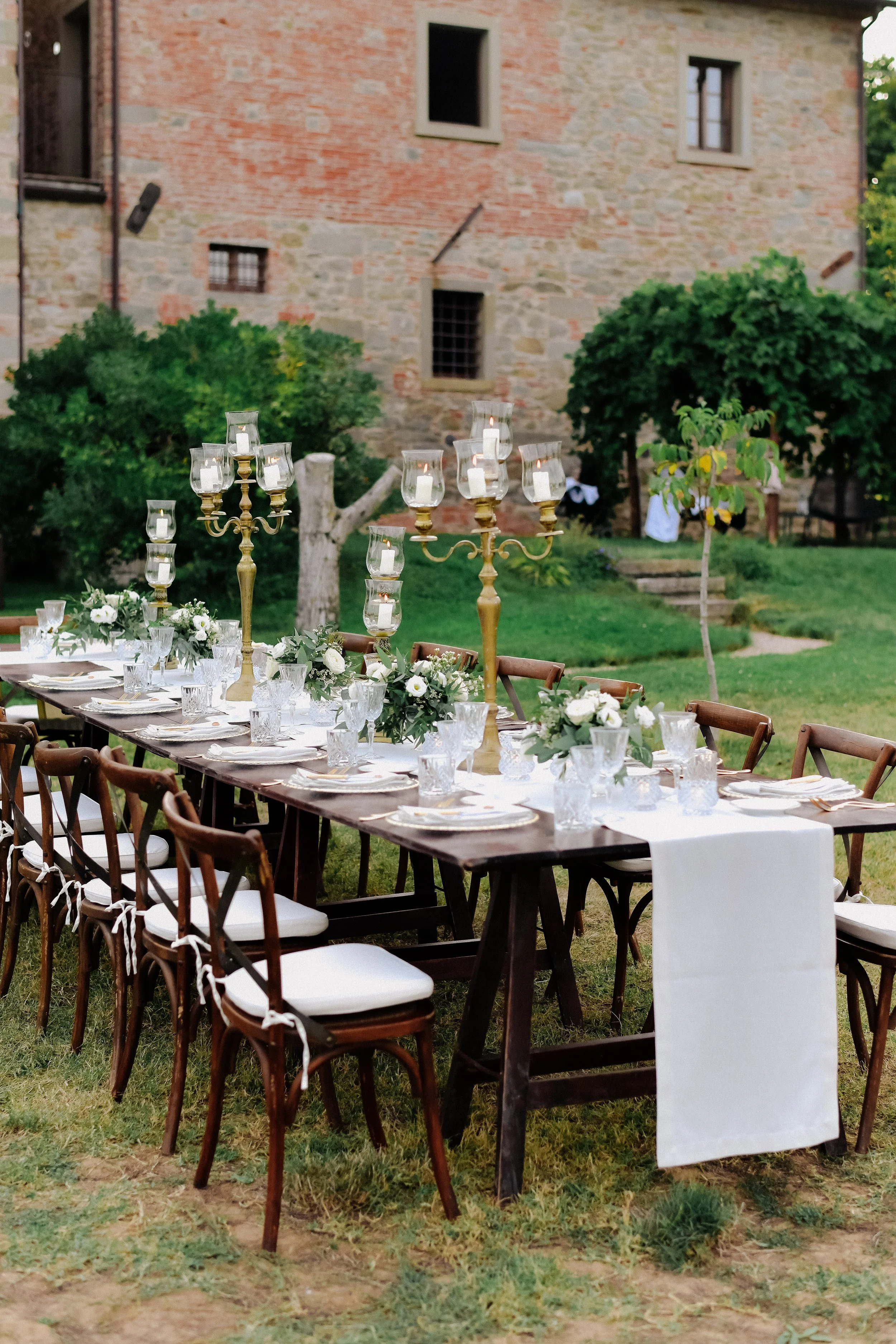 decorated-wedding-celebration-table-with-guests-seats-outdoors-front-old-building-made-stone.jpg