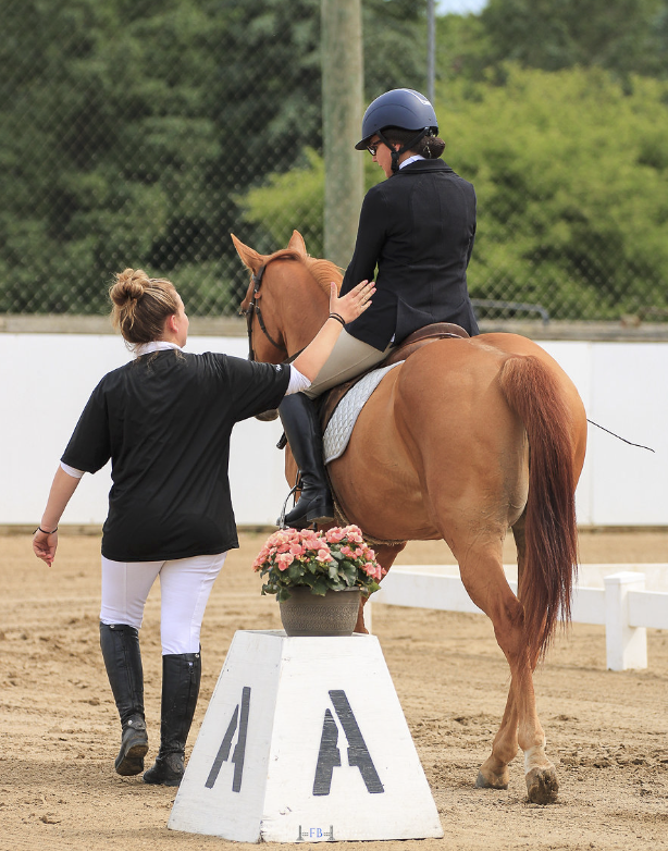 Professional horse trainer Emma Davern with a show client
