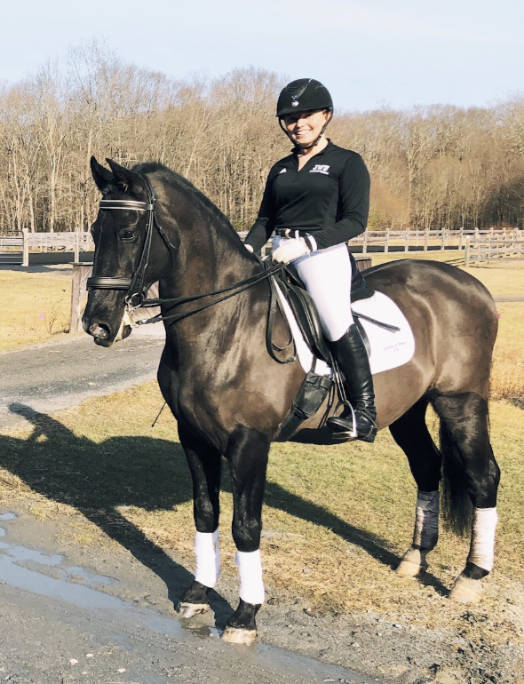Emma competing at a dressage event