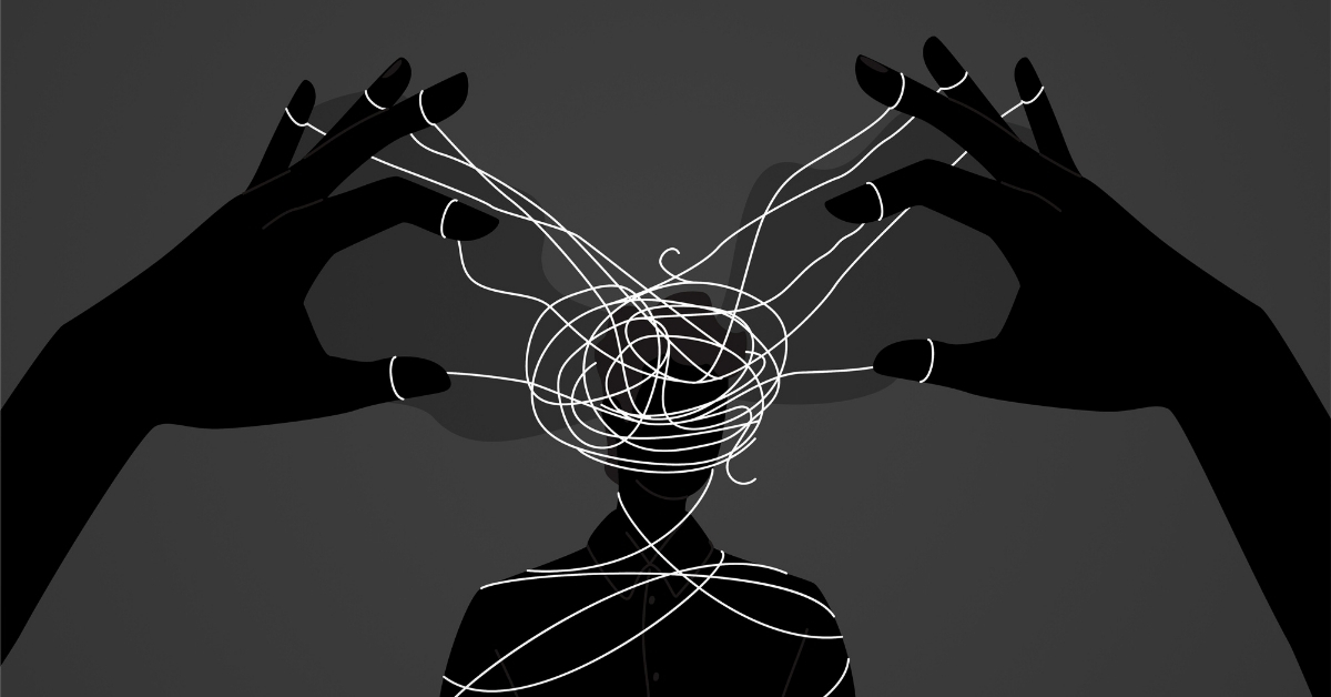 Two hands with multiple string connected are wrapped around another persons head