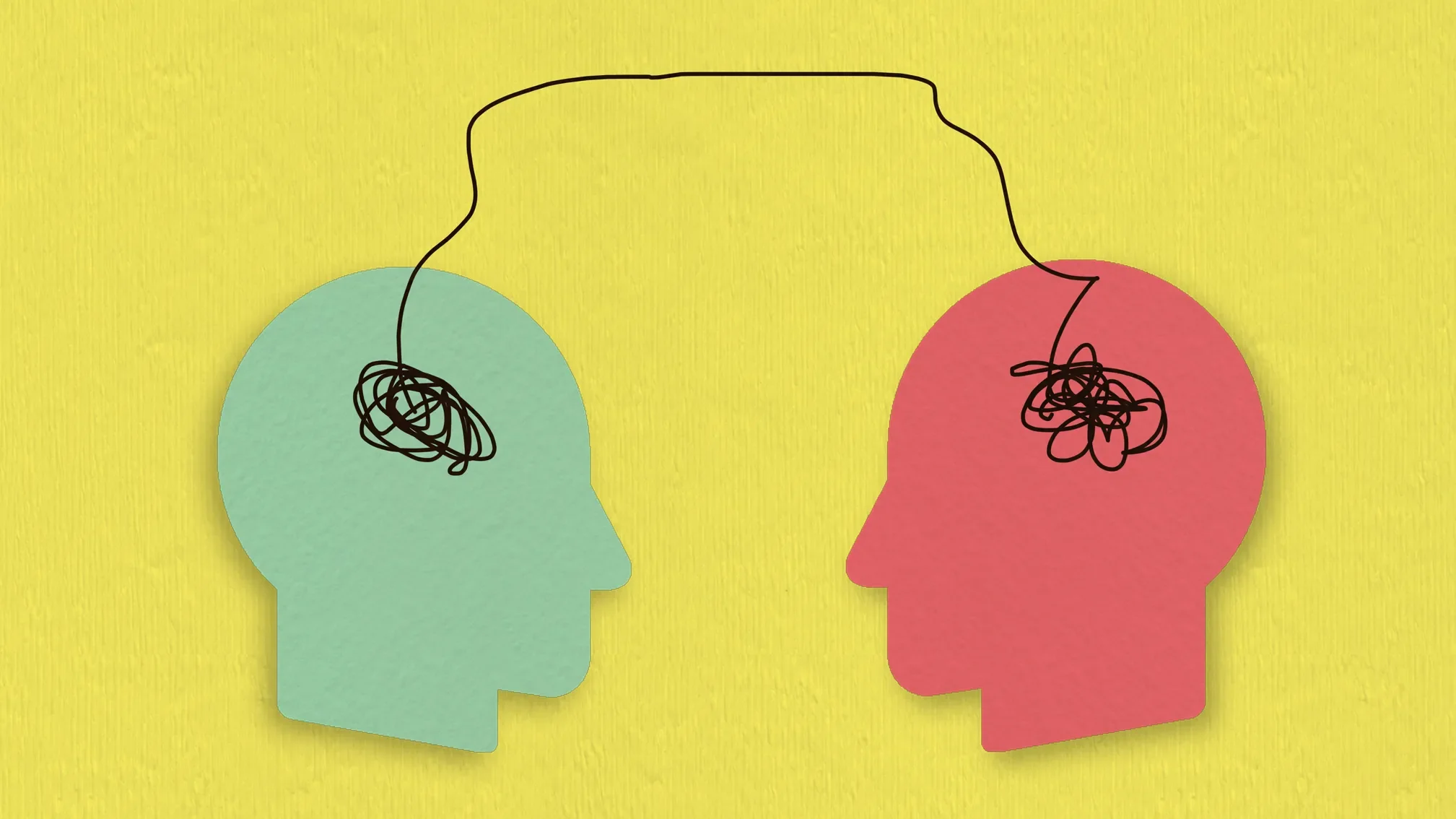 An illustration showing two human heads, with thread between the two minds reflecting communication