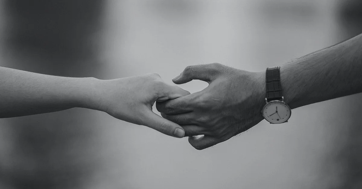 Two hands holding
