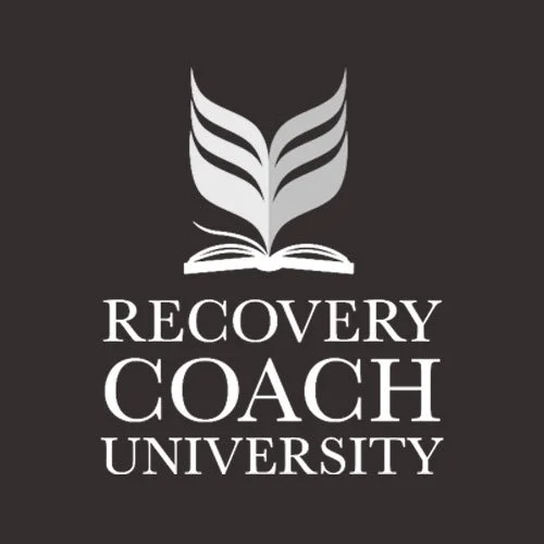 Logo of Recovery Coach University featuring an open book with stylized wings above it, and the text 'RECOVERY COACH UNIVERSITY' below.
