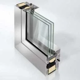 Glass window with a metal frame and internal insulation components. Schuco aluminum European triple glazed Reynaers
