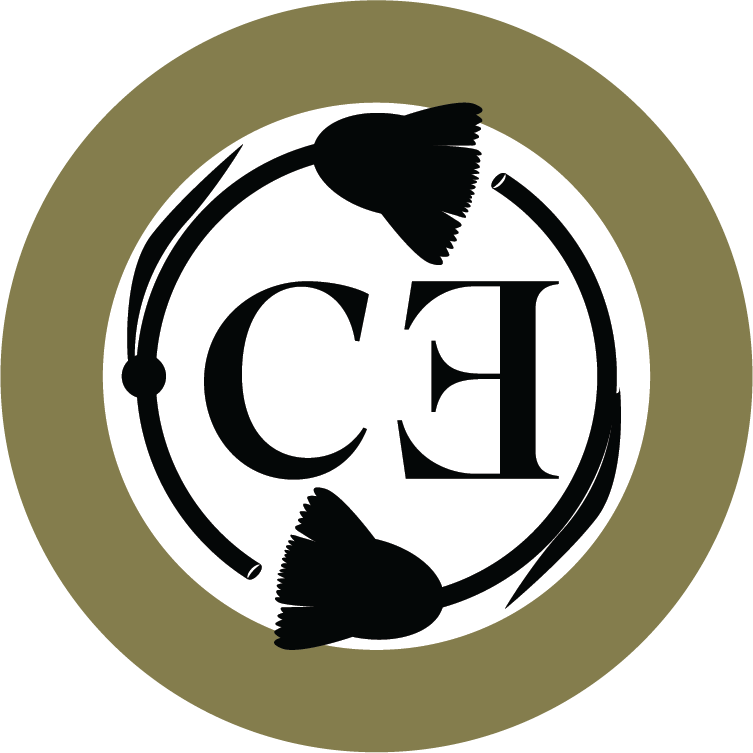 A circular logo featuring two black fish facing opposite directions, surrounded by a white ring with the letters 'CH' in the center.