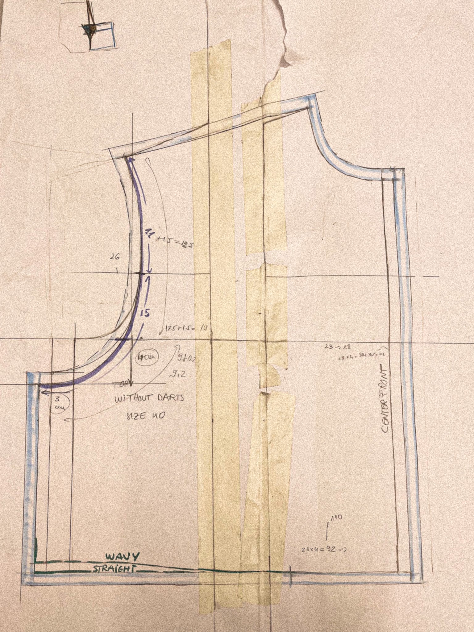 Hand-drawn sketch of a curved technical drawing with measurements and annotations, paper taped to a surface.