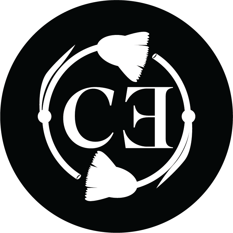 A black circle with white graphic design of two fish, circular borders, and the letters 'CE' in the center.