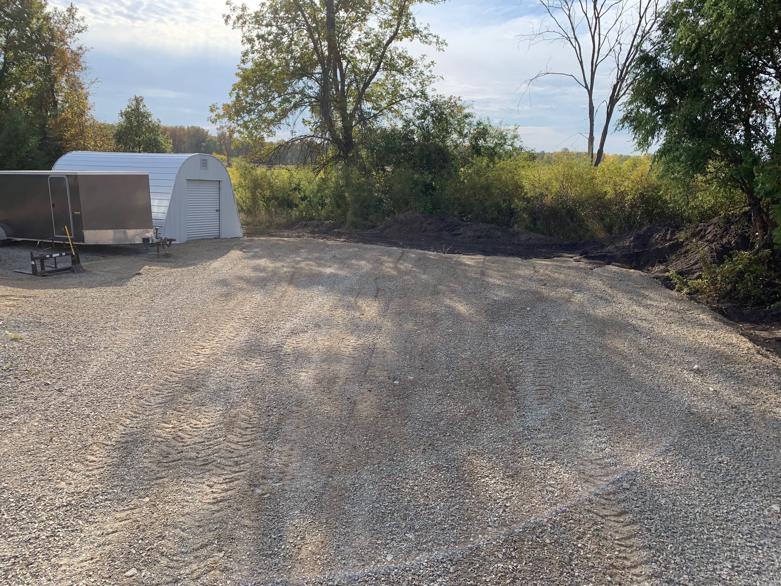 Gravel smoothed out for new parking pad. 
