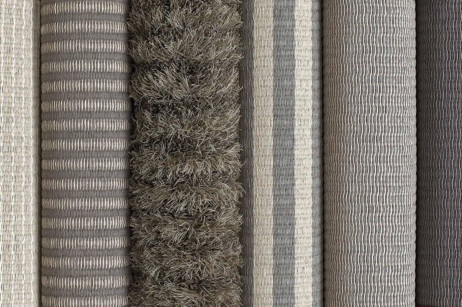 Different Woodnotes carpet samples in a row