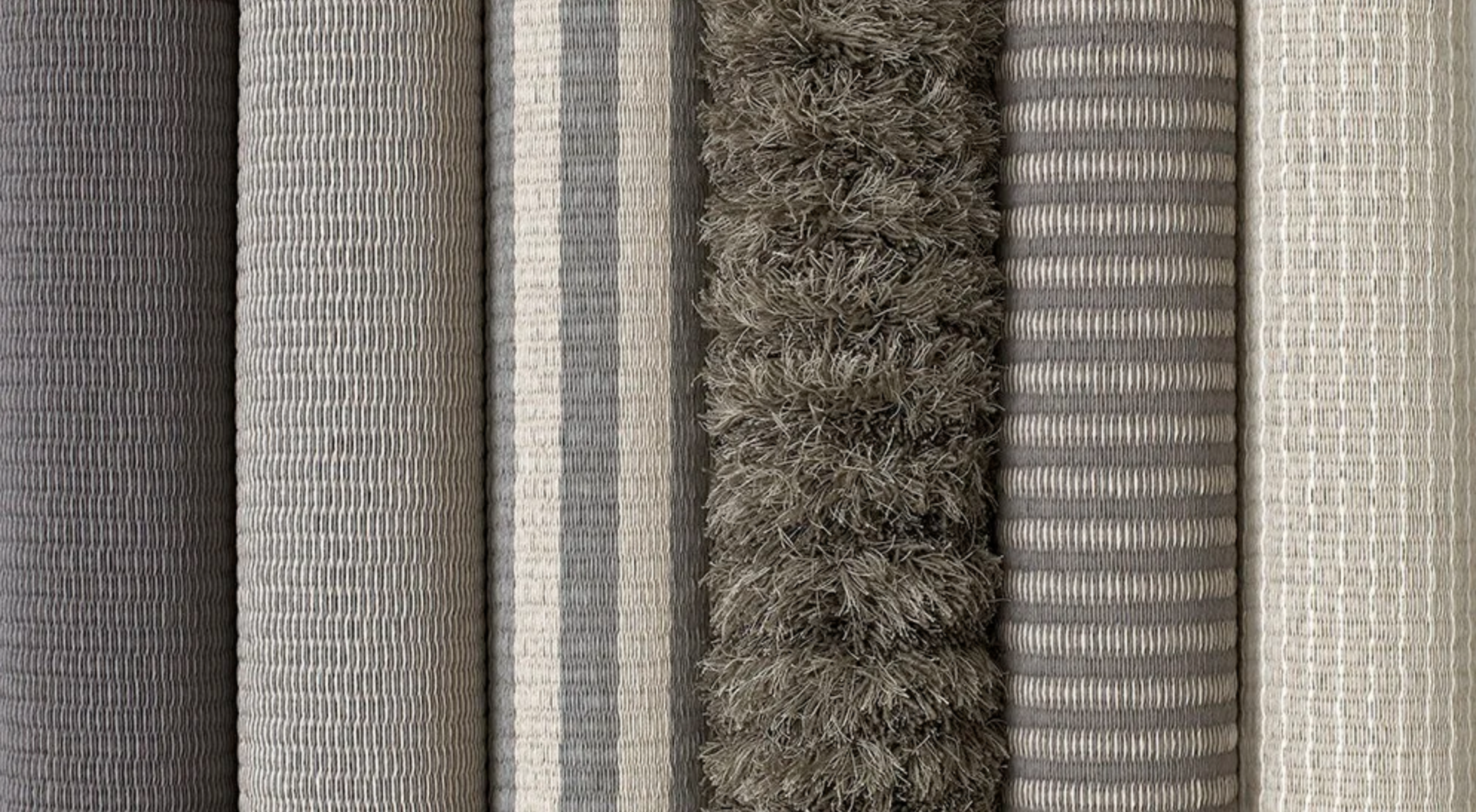 A row of Woodnotes rugs on a roll