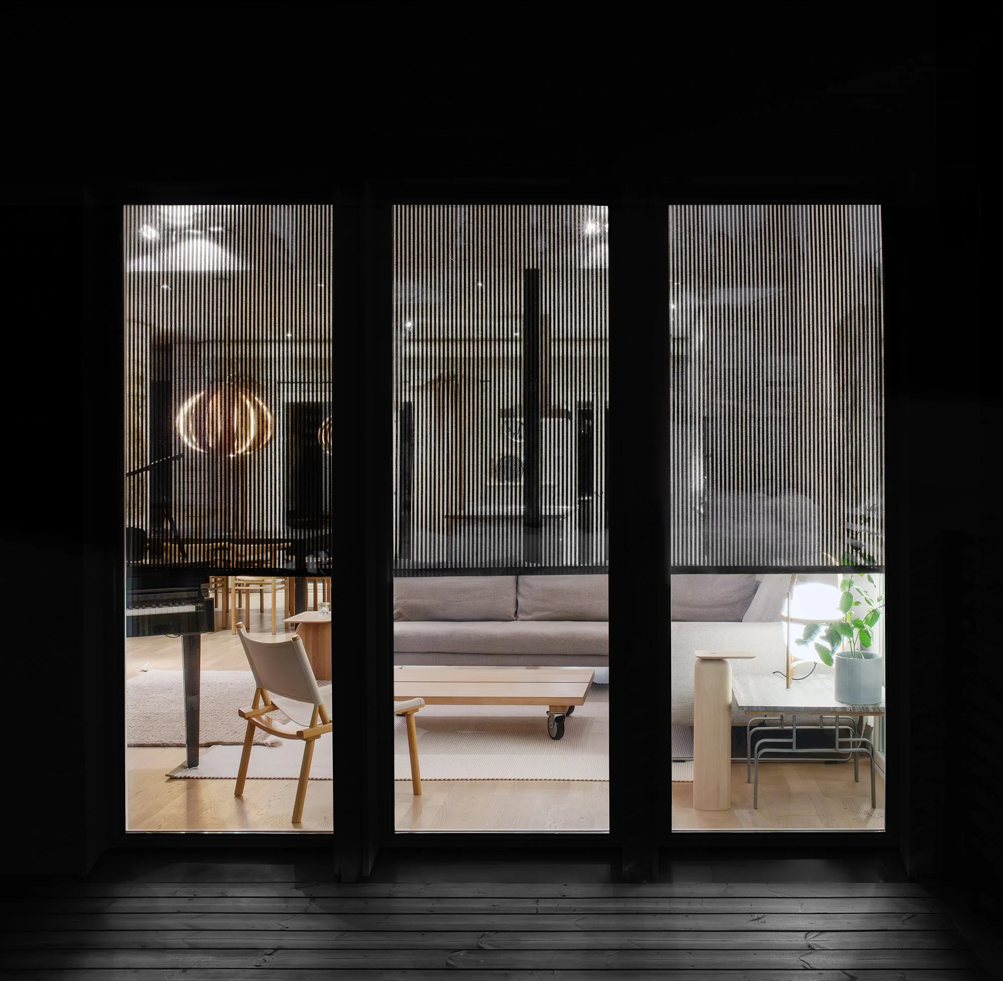 The light transmission of the Vista 213115 col. white-stone fabric when it is dark outside and there are lights inside.