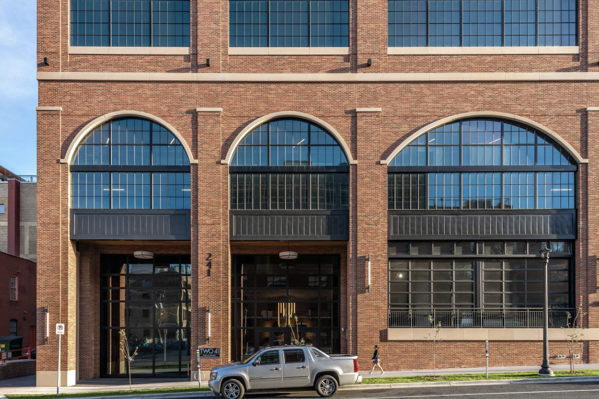 Front of a large brick building, project by DJR Architecture